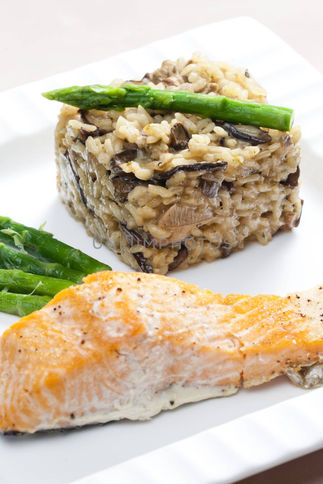 baked salmon with mushroom risotto and green asparagus