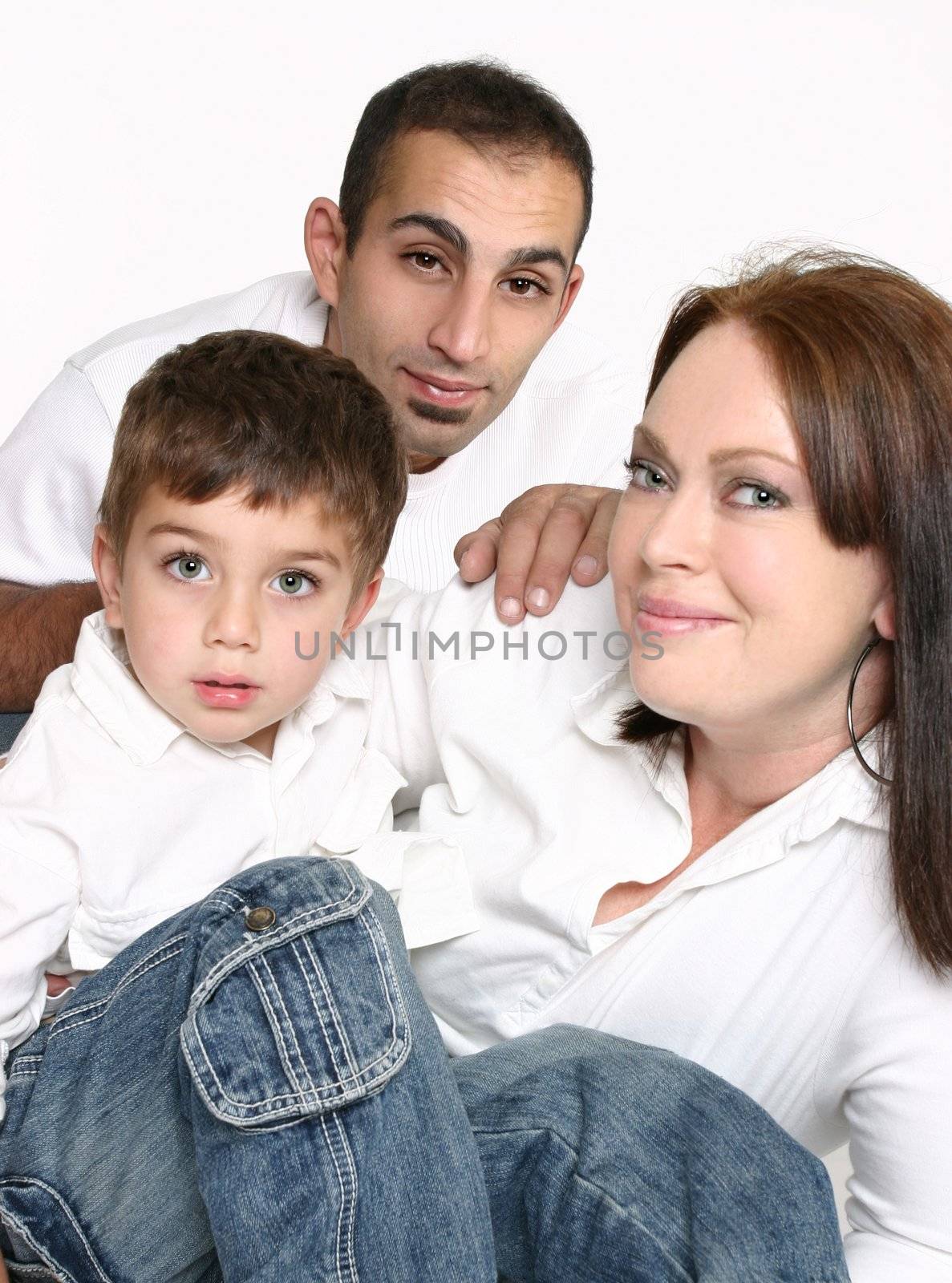 Mixed race family sitting together.