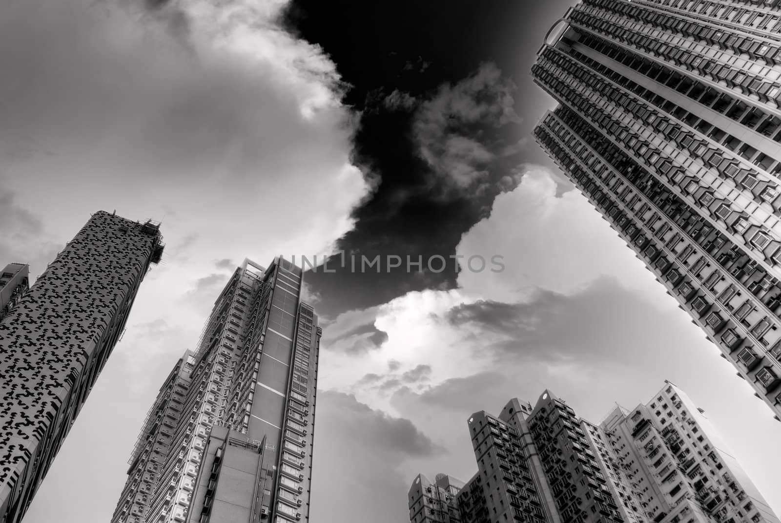 Dramatic high buildings touch sky in Hong Kong.