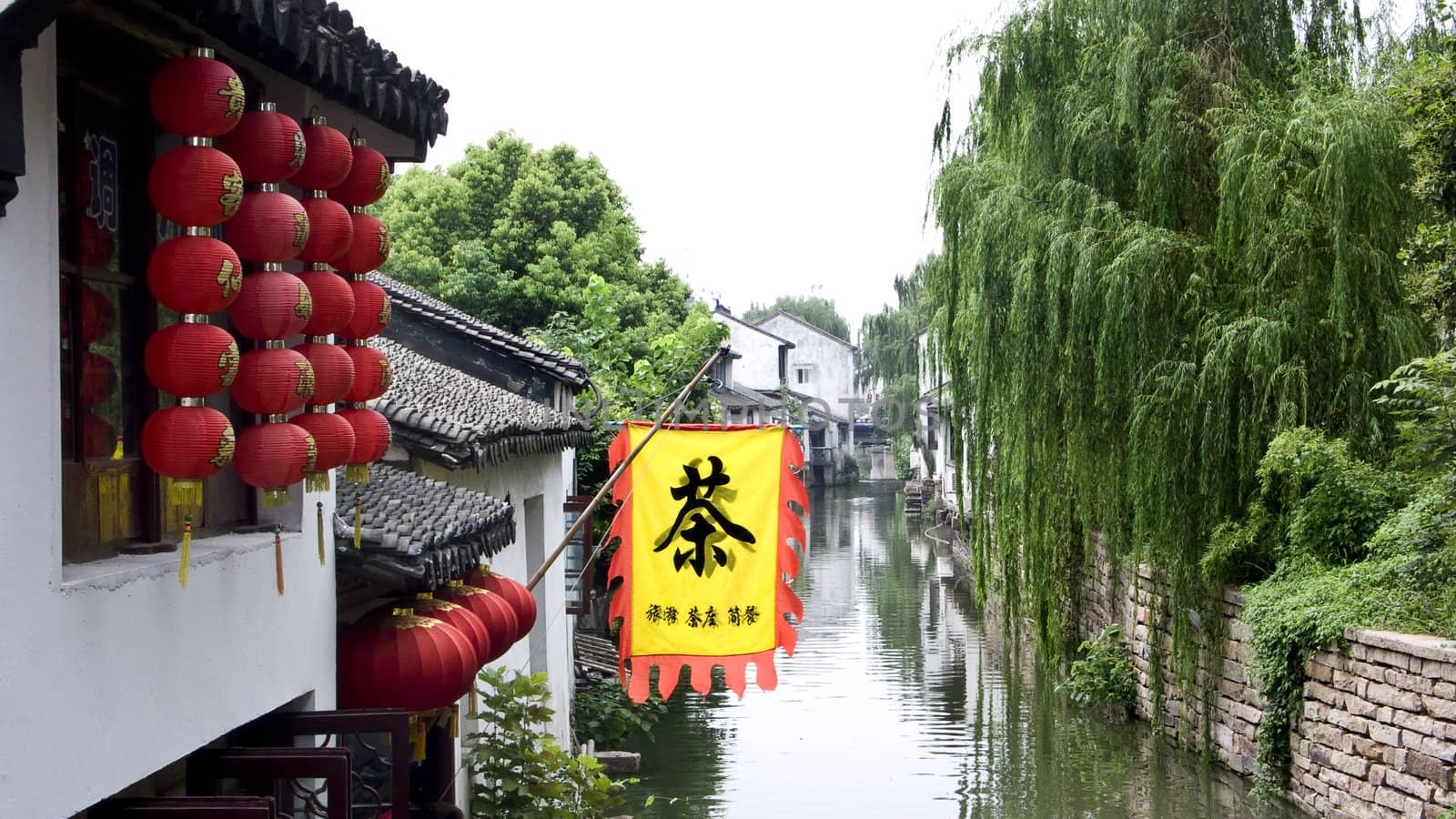 Red lanterns hanging from the ancient architecture