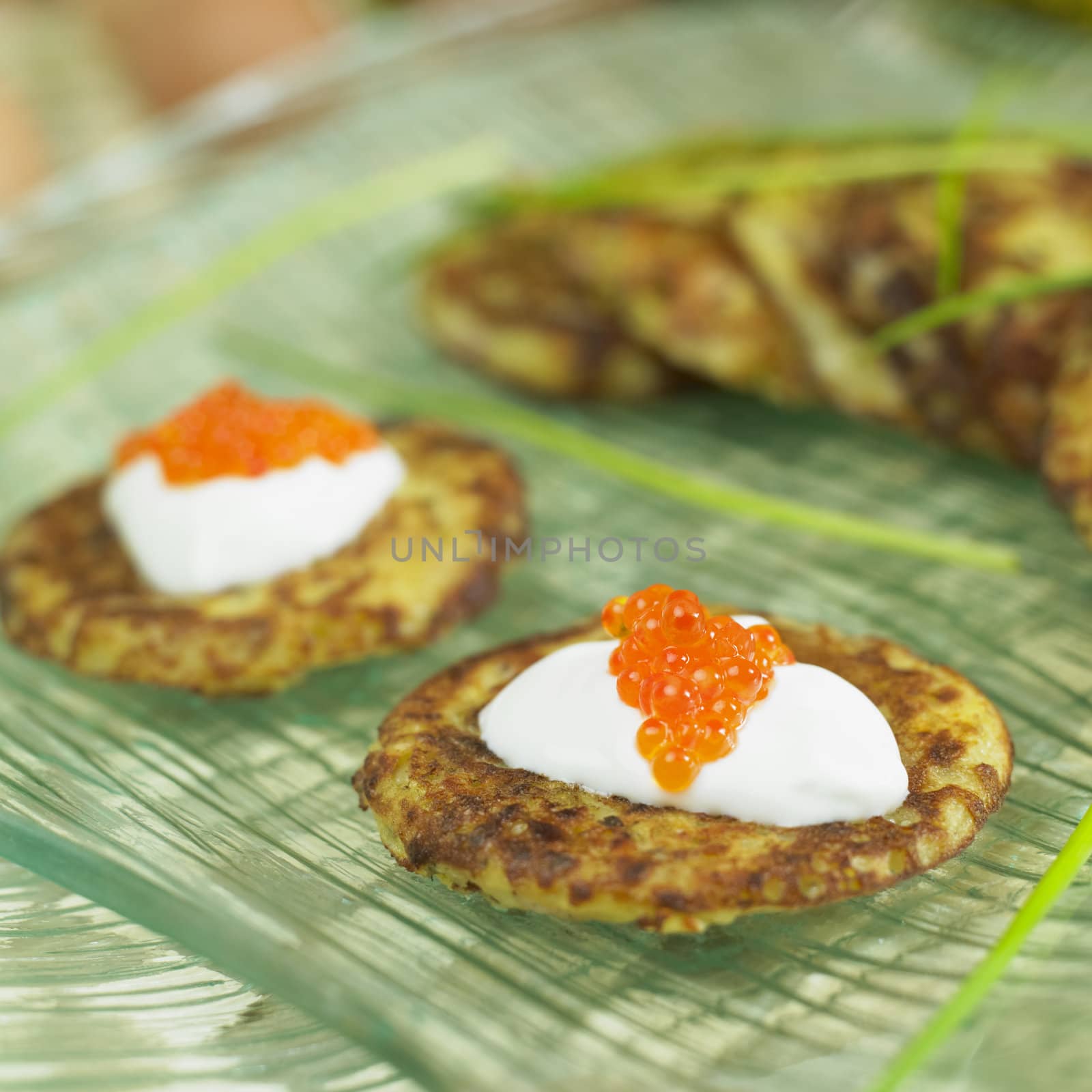 potato cake with cream and caviar