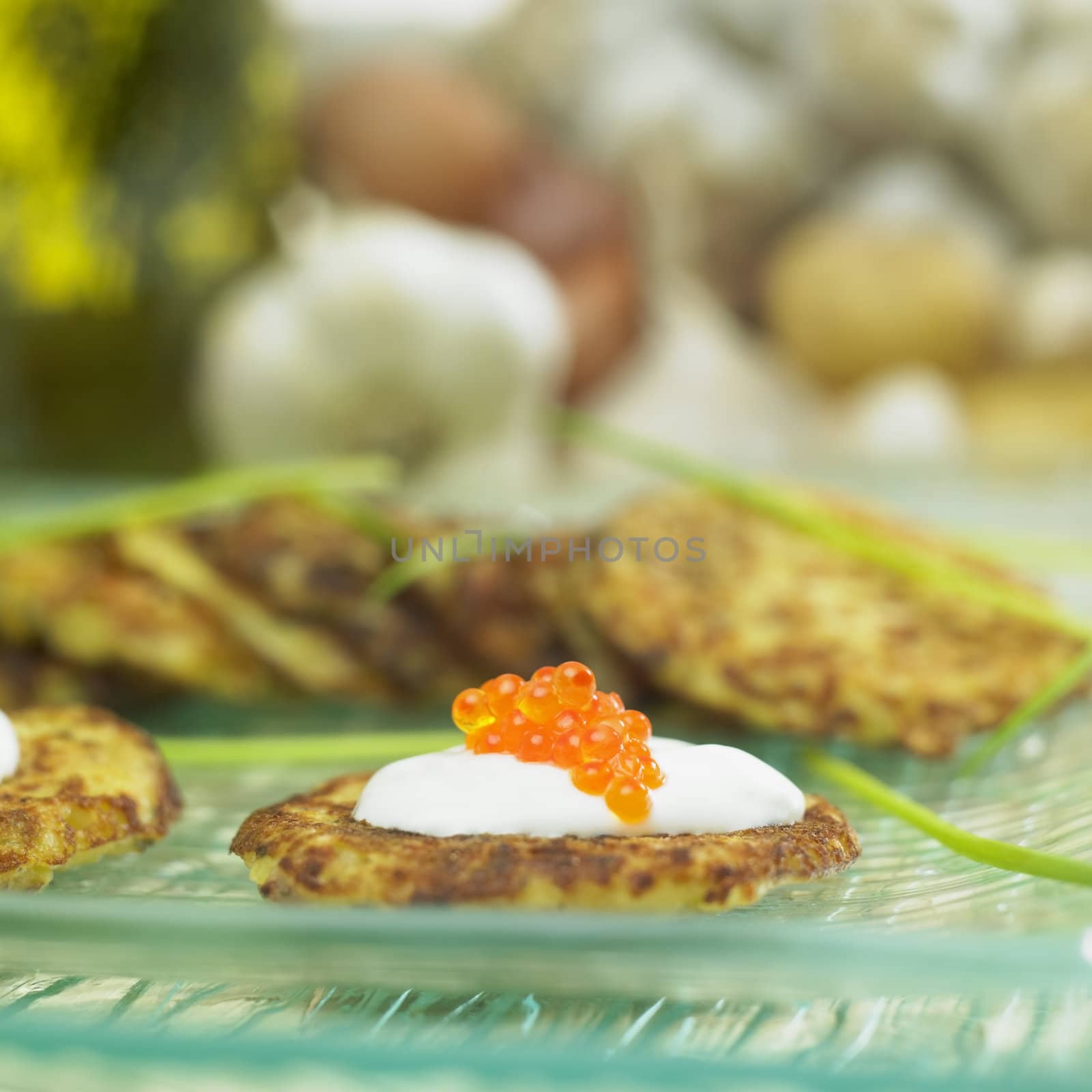 potato cake with cream and caviar