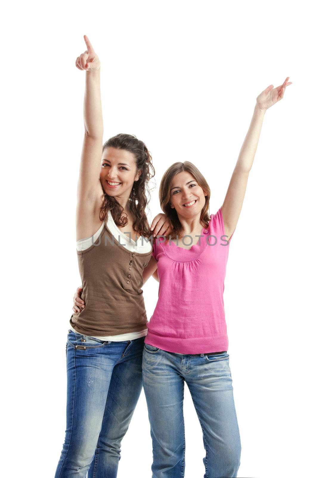 Two beautiful and happy young women isolated over white background
