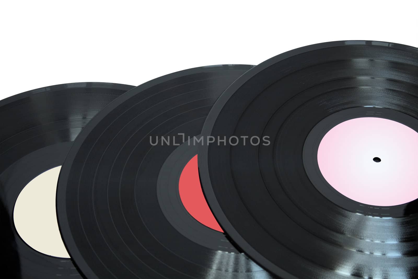 Closeup of three vinyl records isolated on white with clipping path