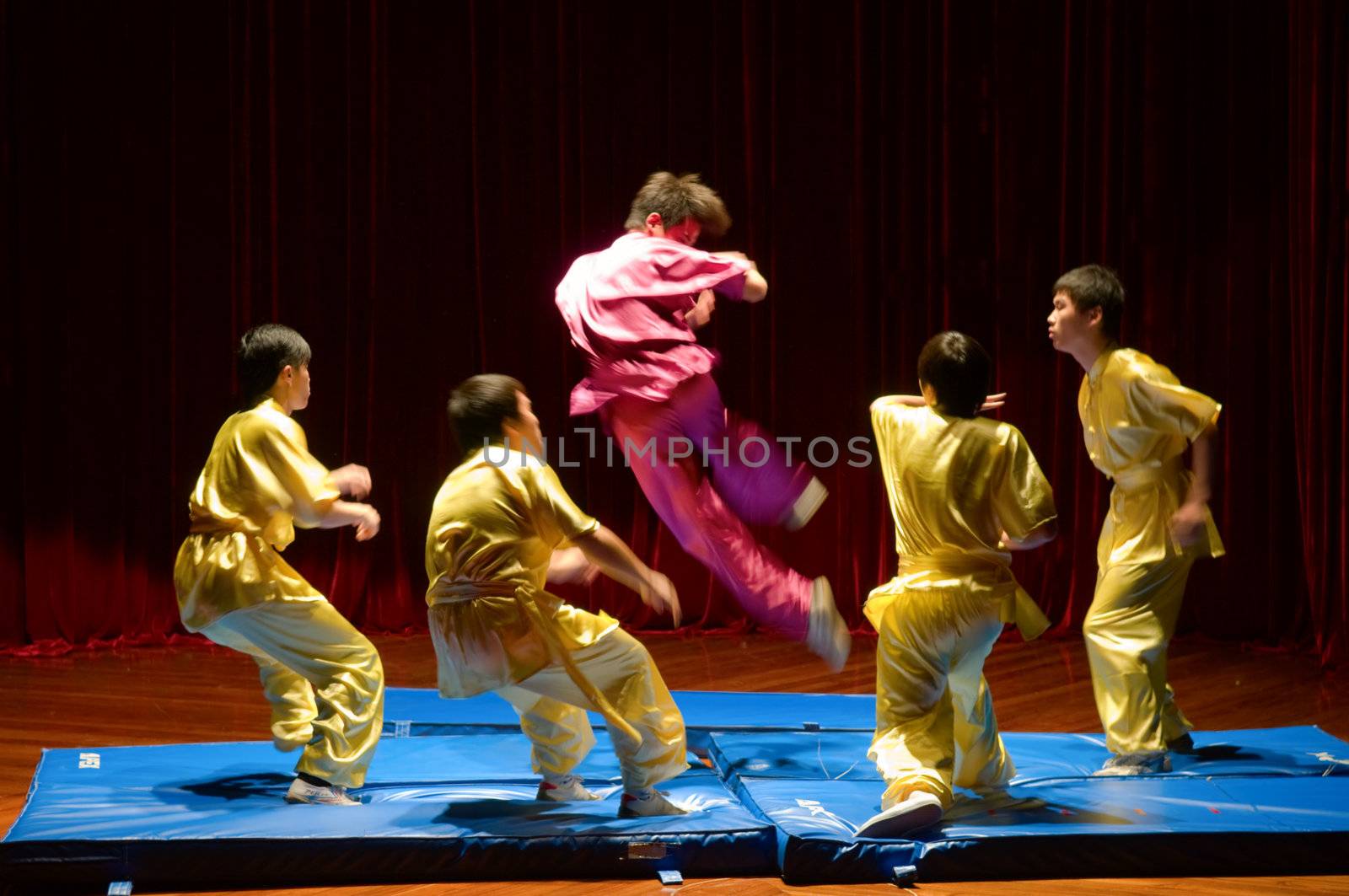 MACAU - APRIL 25: Performing Chinese kung fu (wu shu) with pose of kicking enemies, April 25, 2009, Macau, China