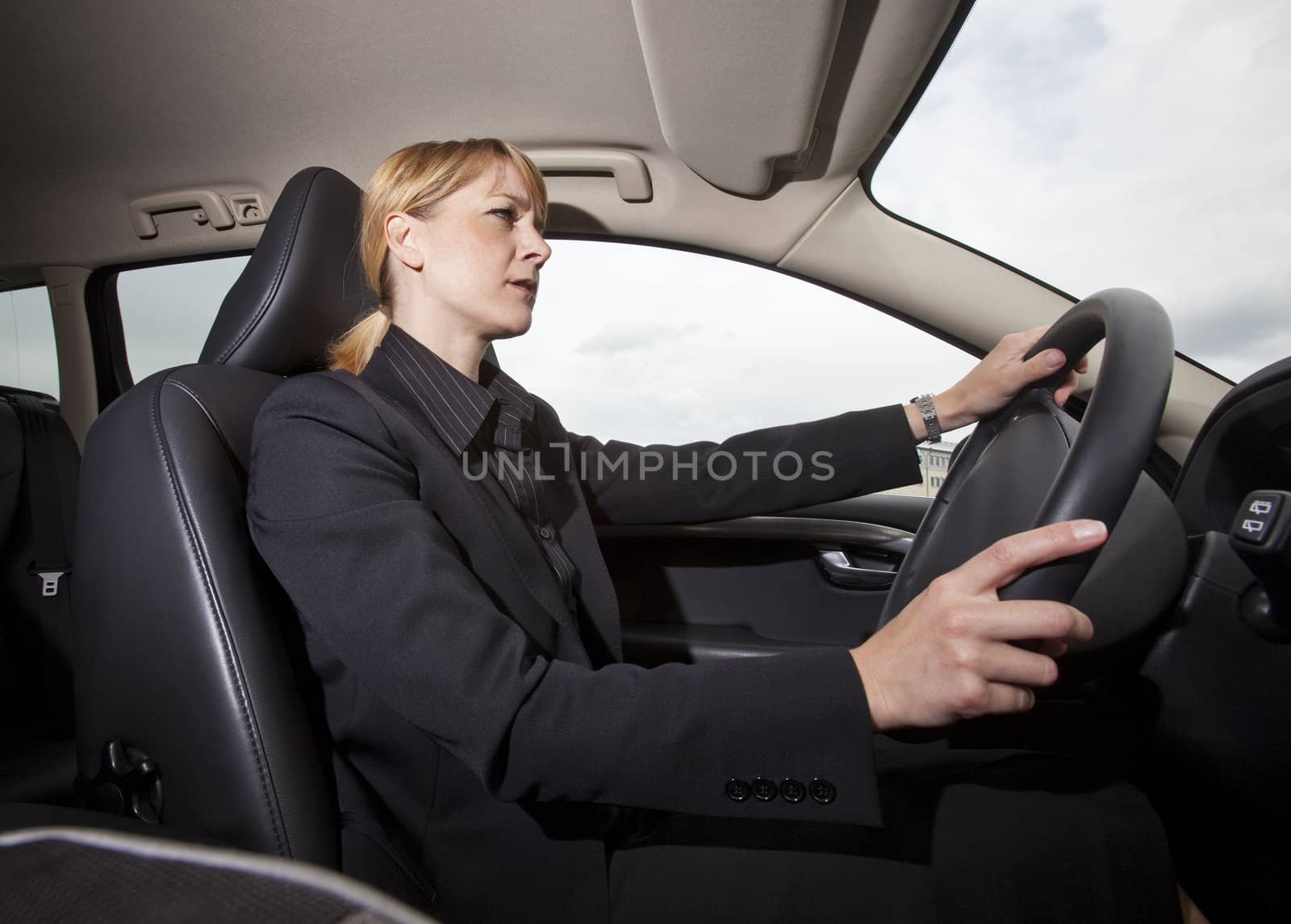 Woman driving her car by gemenacom