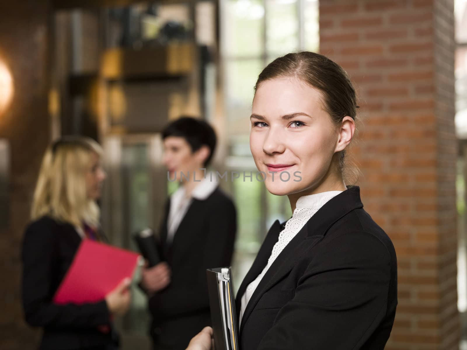 Businesswoman in front of her team by gemenacom
