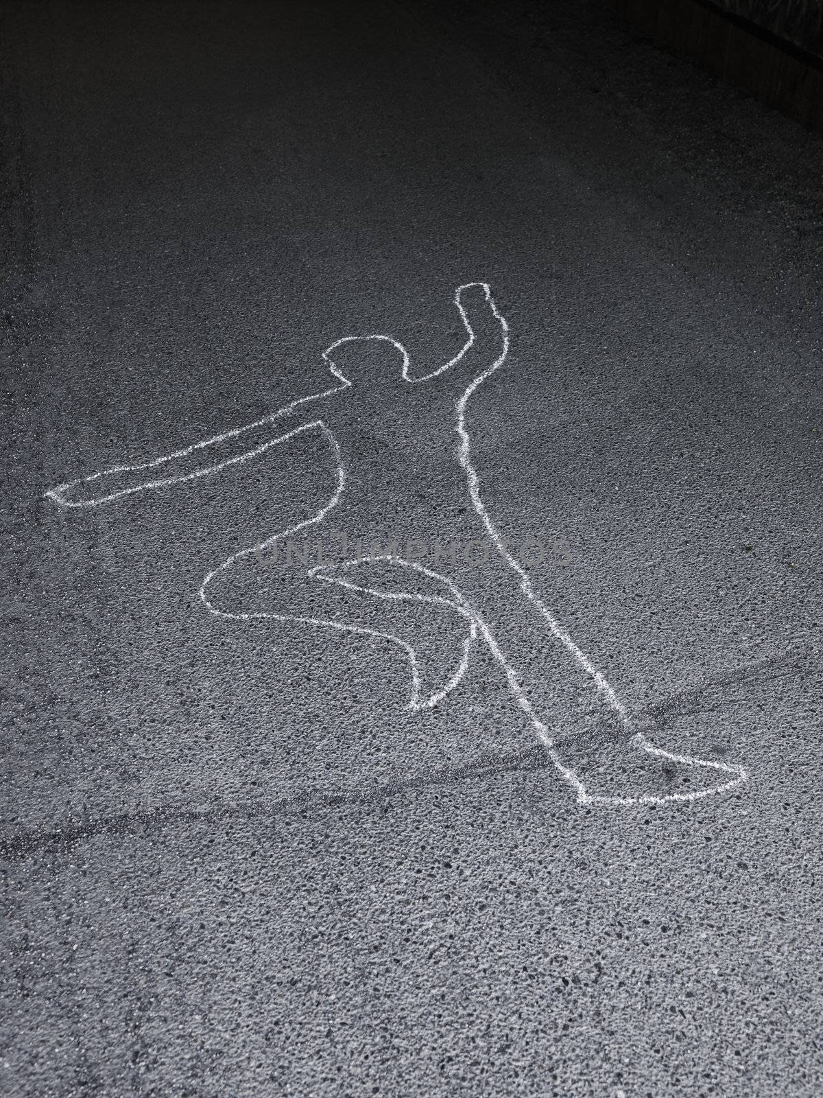 Contour of a person drawn at the asphalt