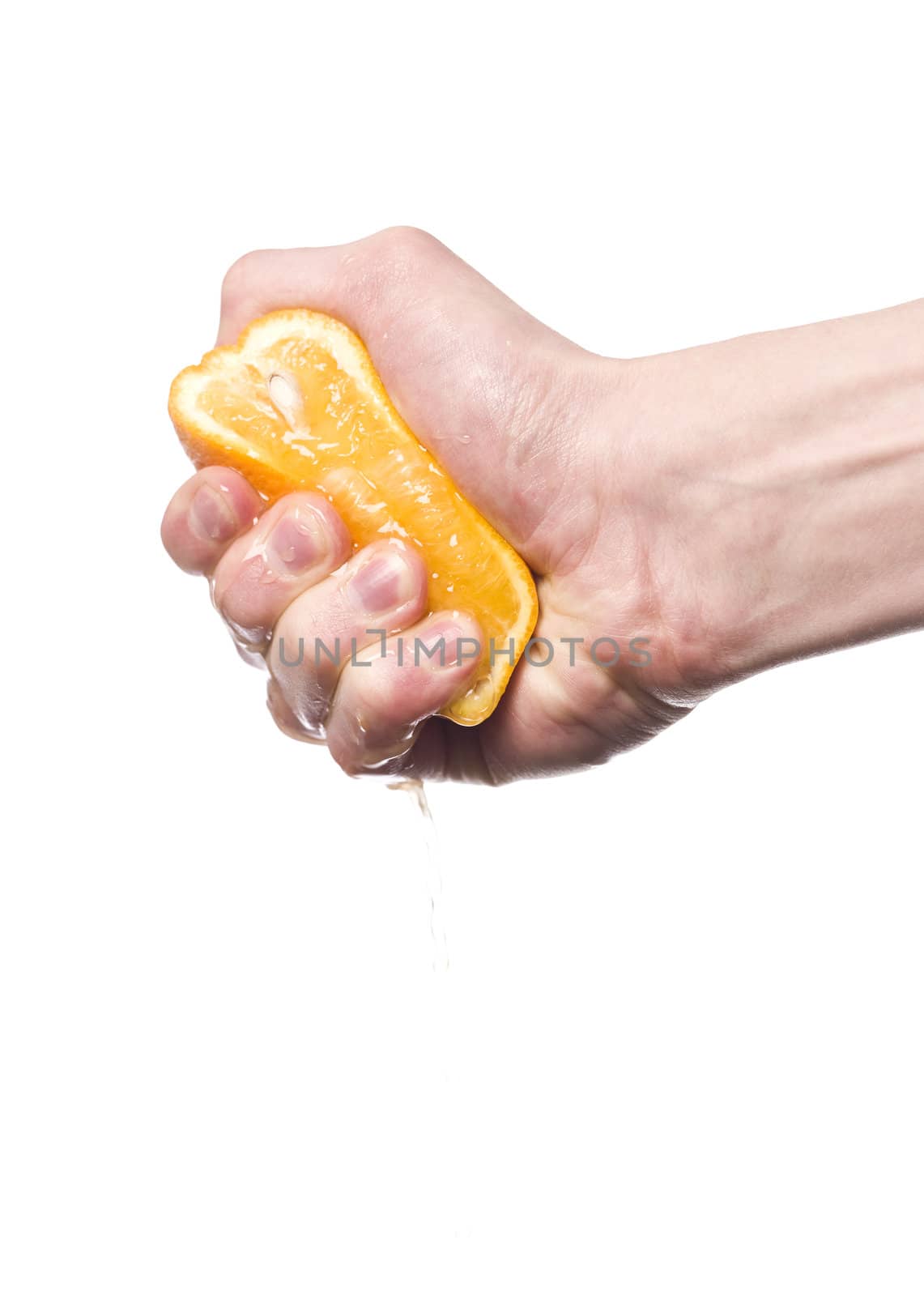 Hand squeezing an orange towards white background