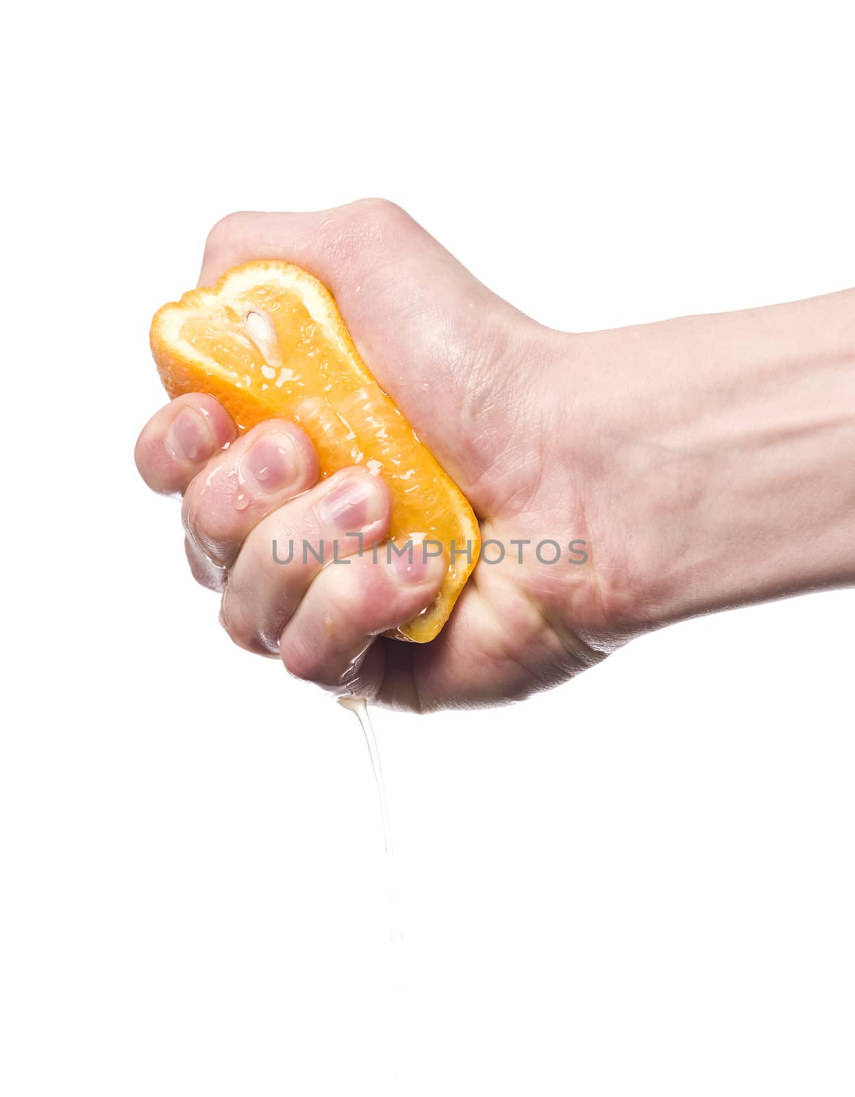 Hand squeezing an orange towards white background