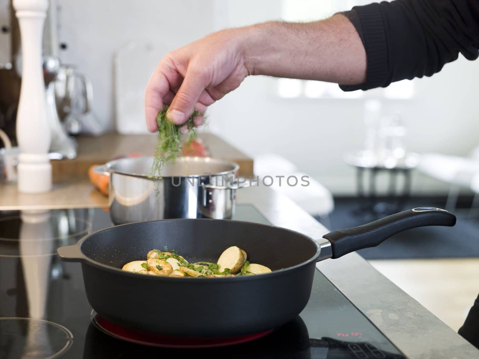 Man working with food in a elegant enviroment. by gemenacom