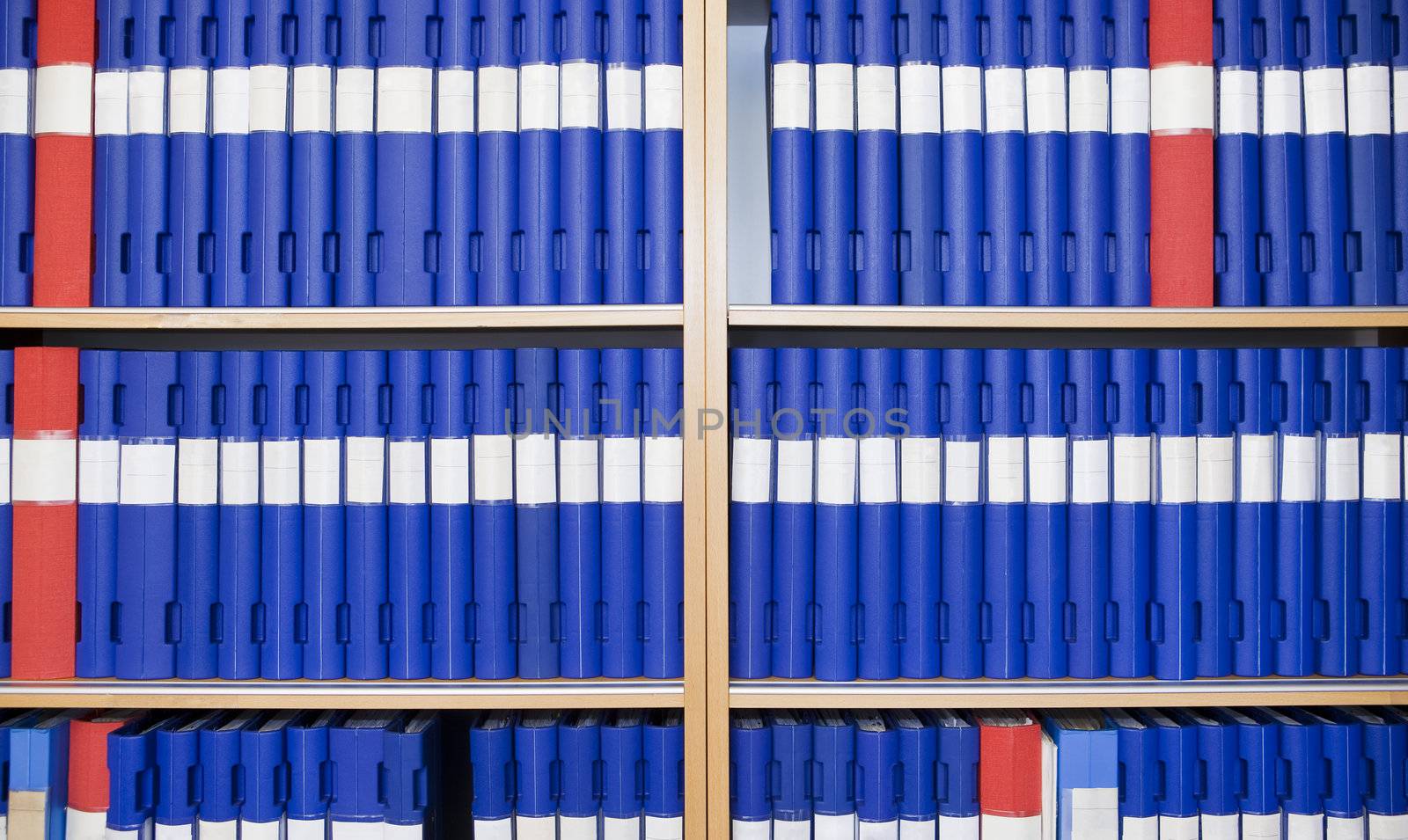 Several binders in a bookcase by gemenacom