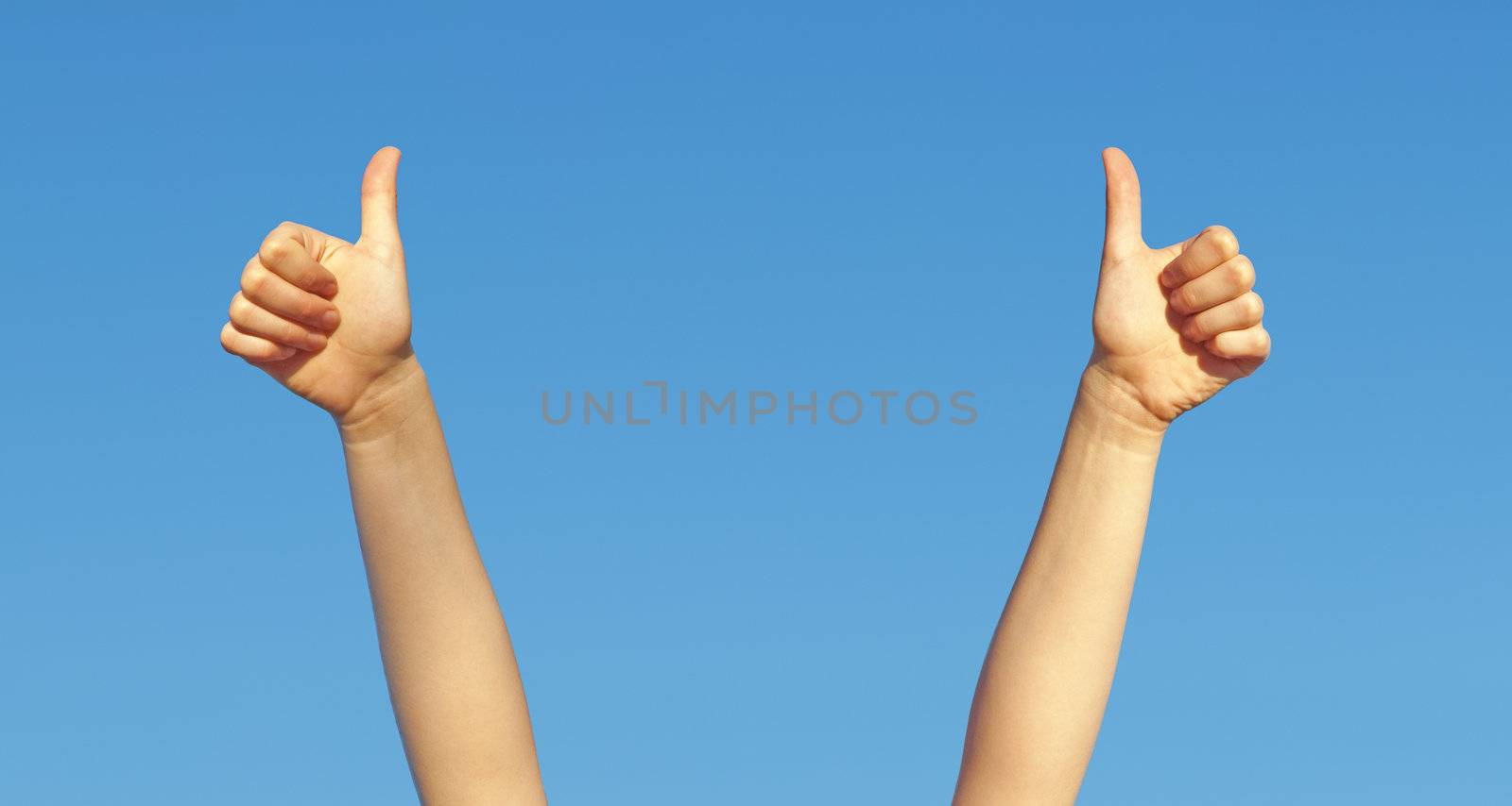A photography of two hands thumbs up