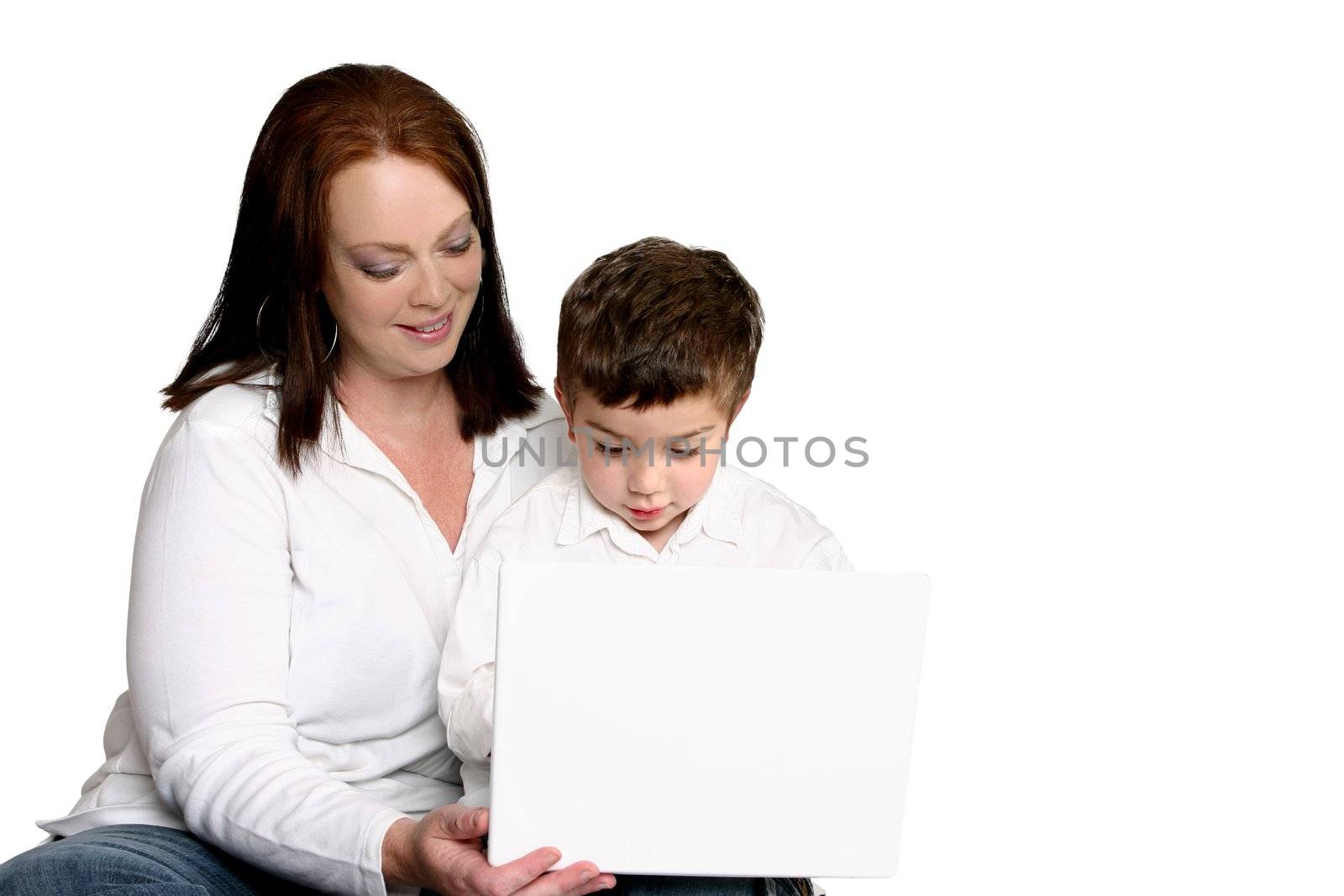 Early childhood education.   A toddler using a laptop computer.