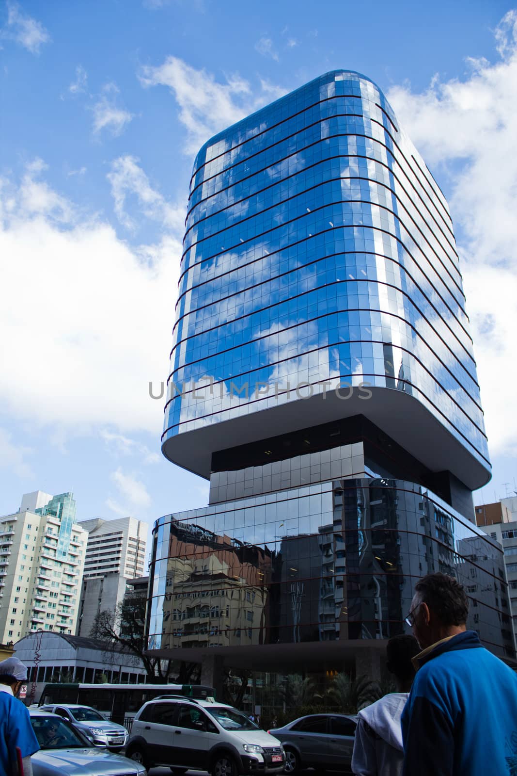 modern glass building on busy Avenida Paulista