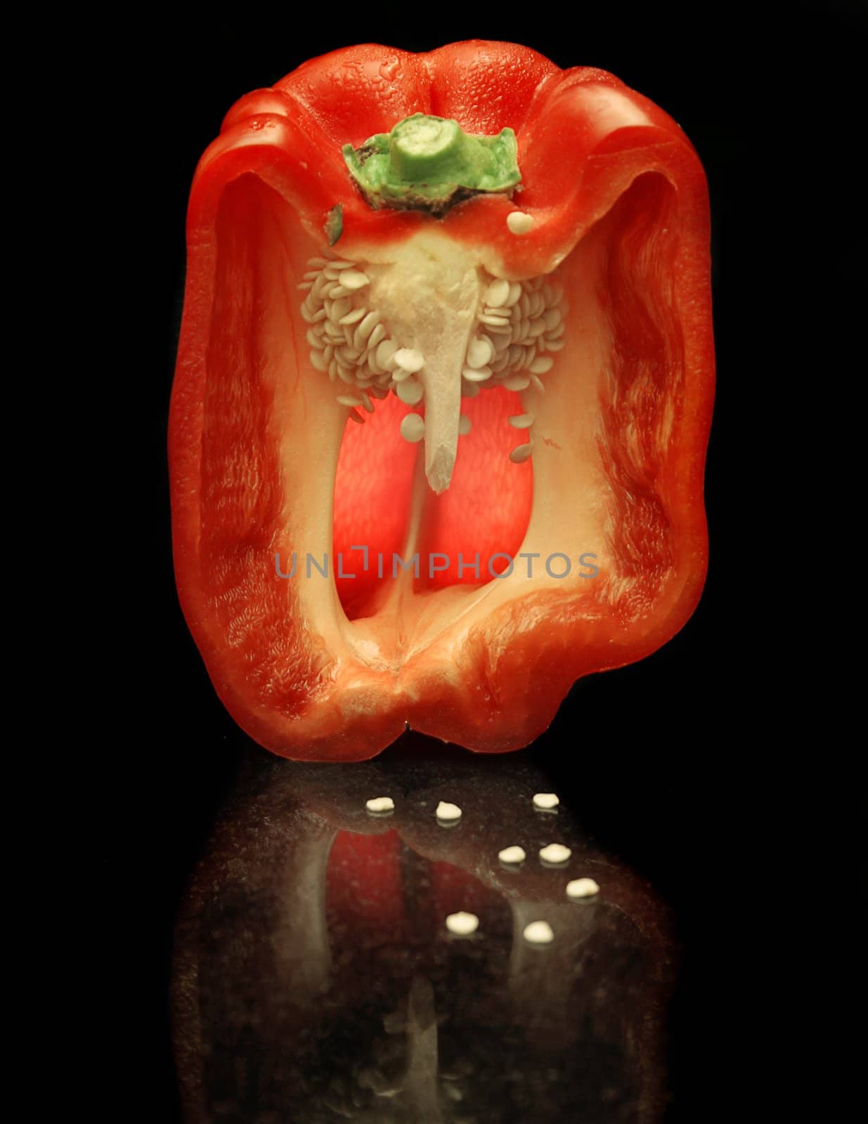 Wet Red Capsicum cut in half by lovleah