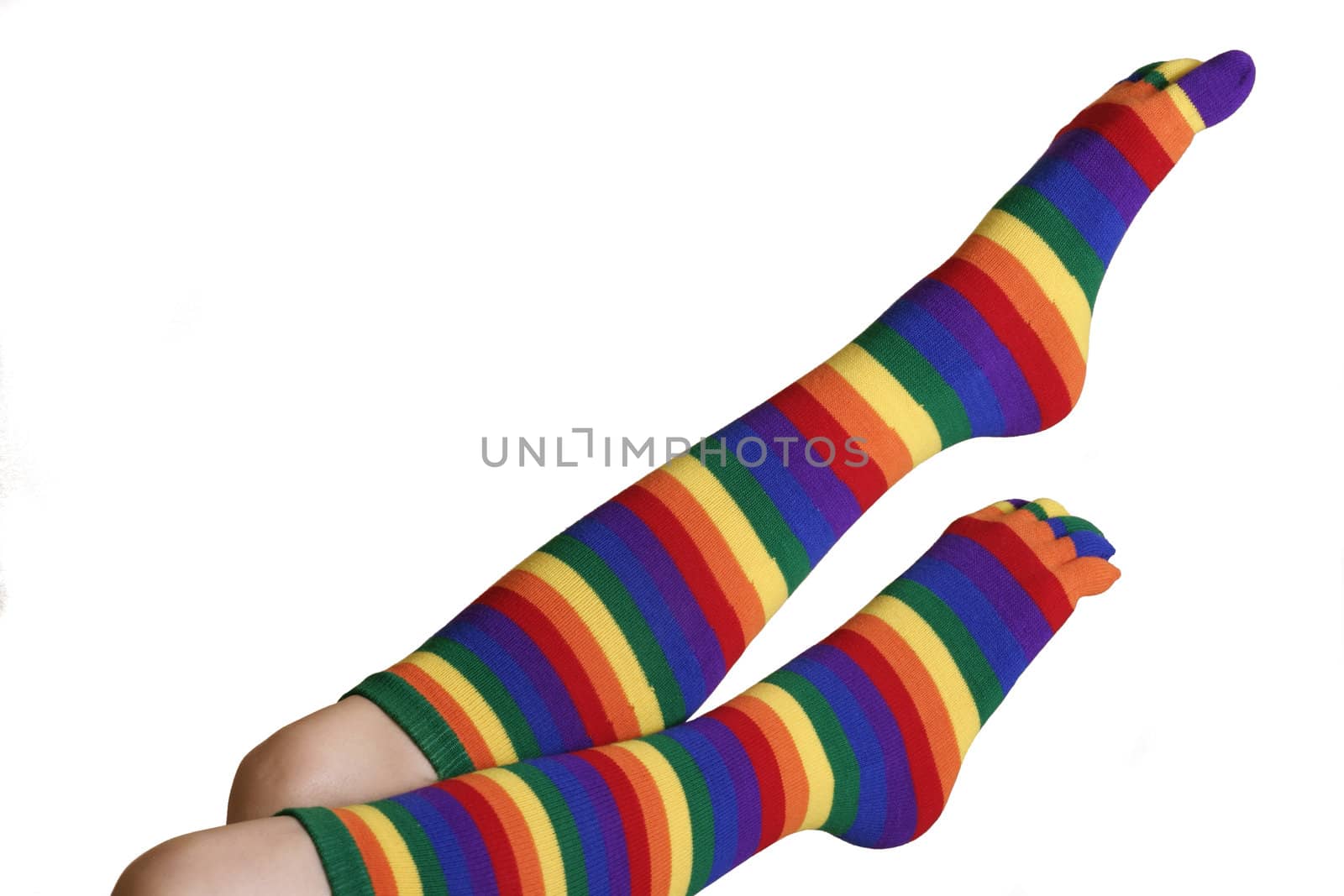 Legs showing knitted wool socks in stripey colours.