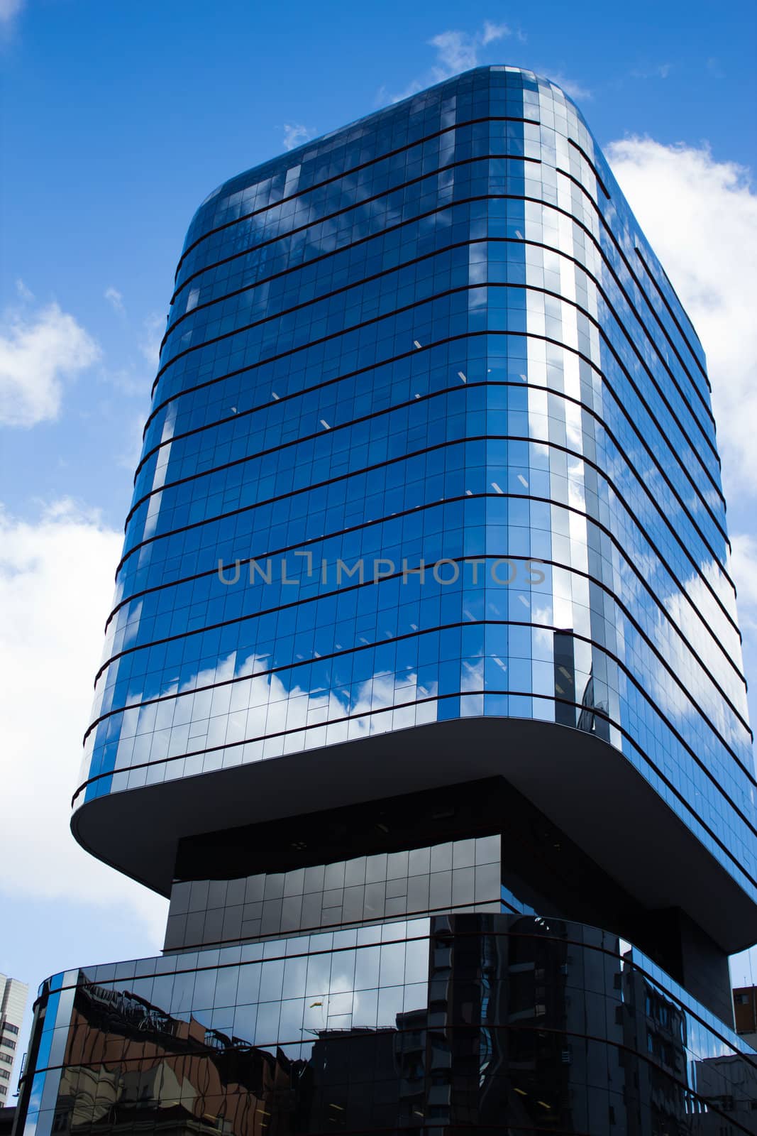 modern glass building on busy Avenida Paulista