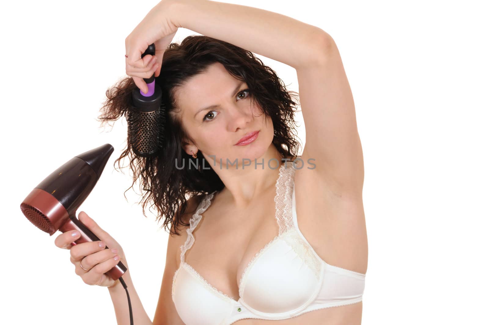 The woman dries the hair dryer hair