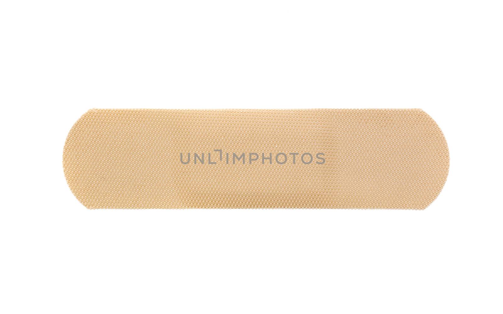 Beige bandaid isolated on a white background