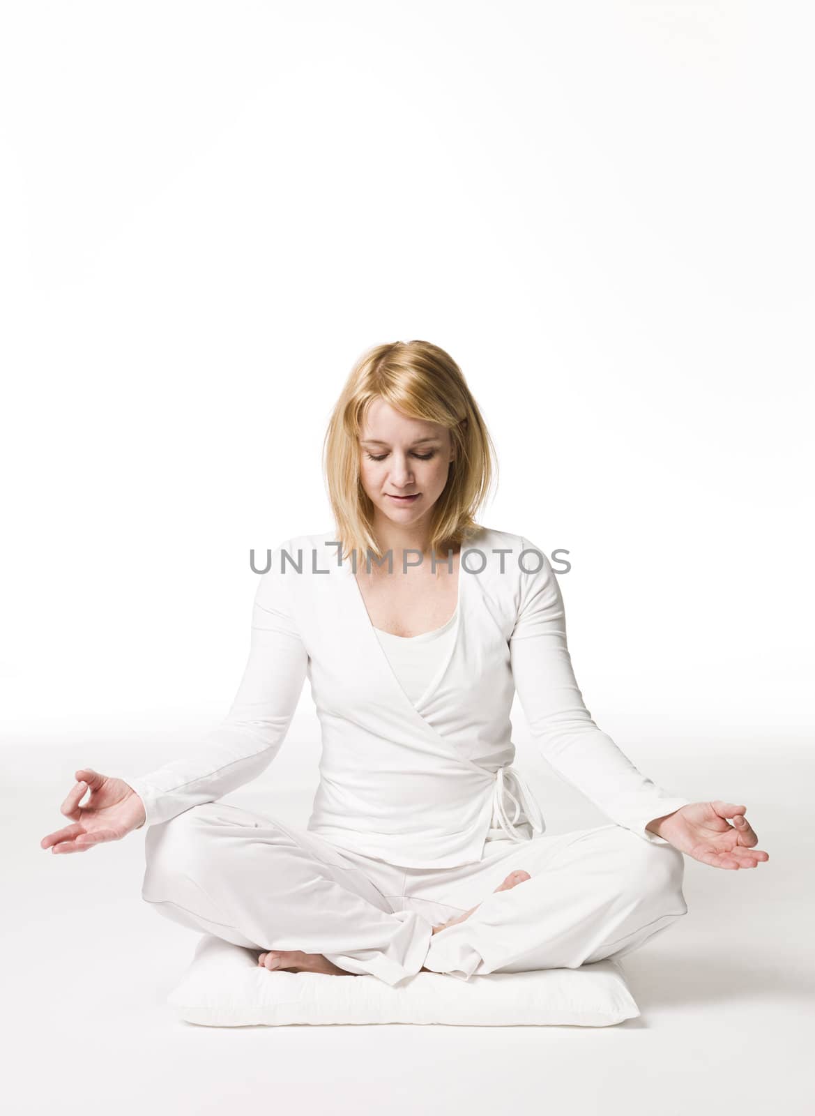 Woman meditating by gemenacom