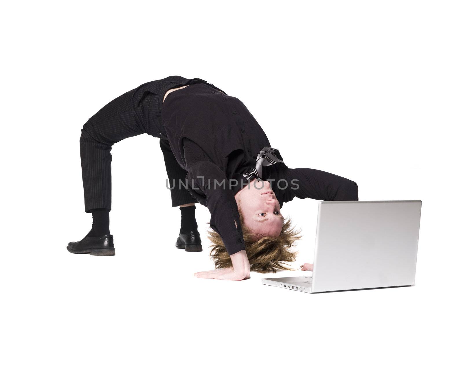 Acrobatic man in front of a computer by gemenacom