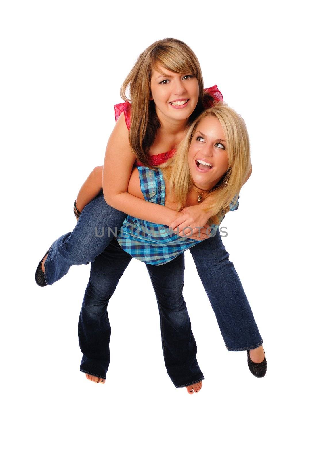 two women having fun doing the piggy back ride