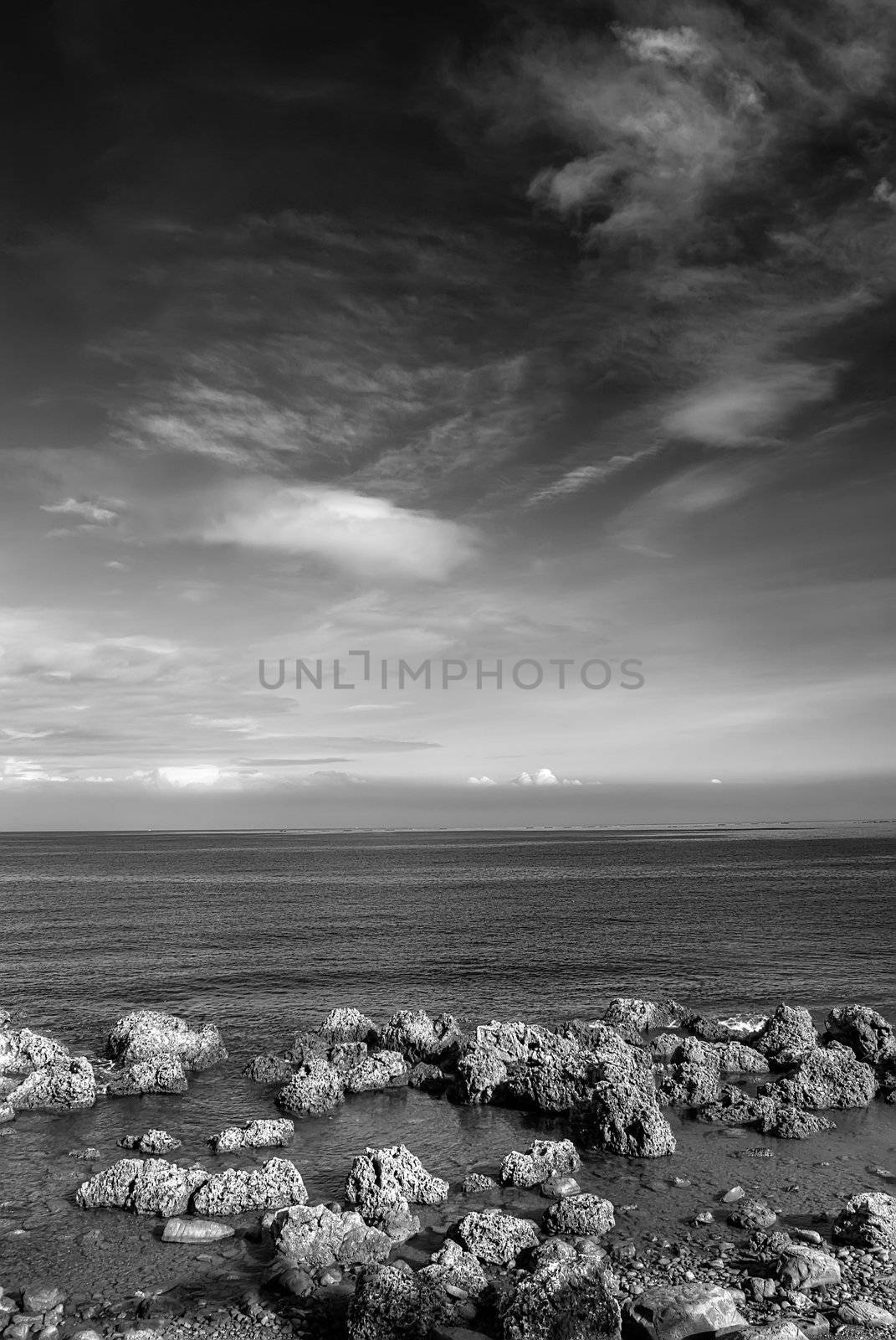 Beautiful landscape coral reef rock ocean and amazing sky and clouds.