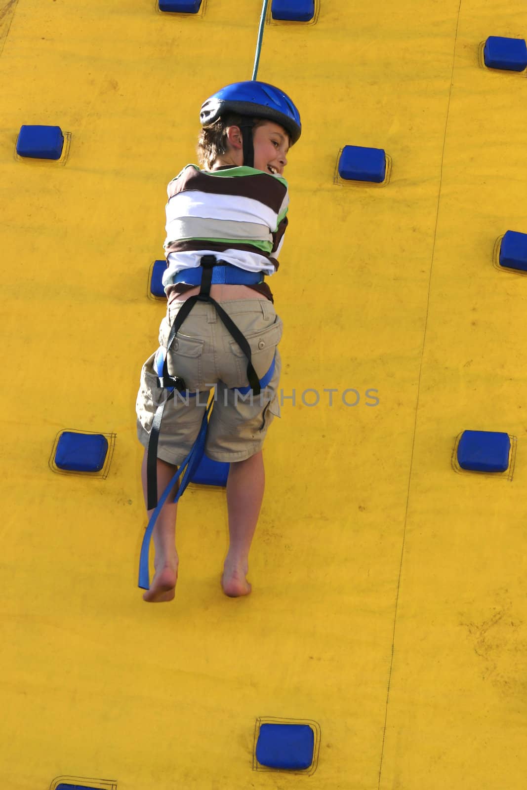 Abseilling down a climbing wall