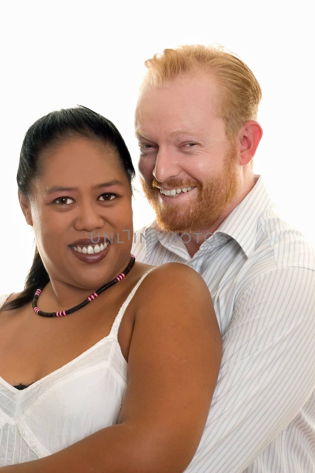 Happy diversity couple smiling and looking ahead