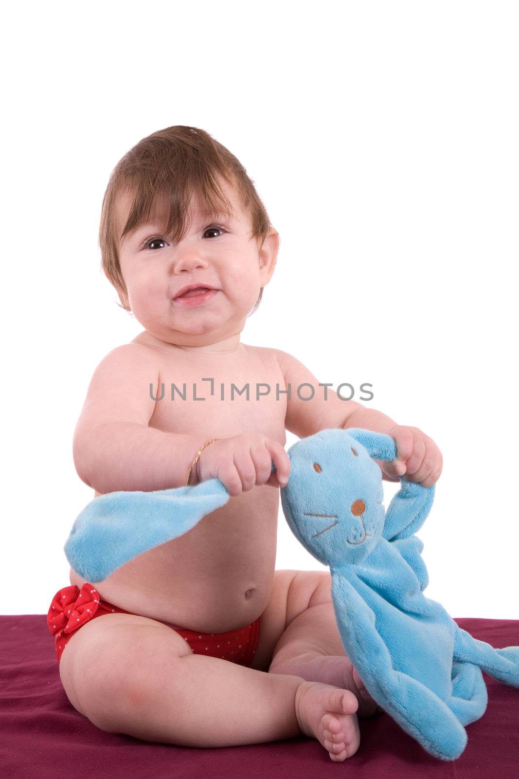 Happy little baby with her play bunny on white backgroun