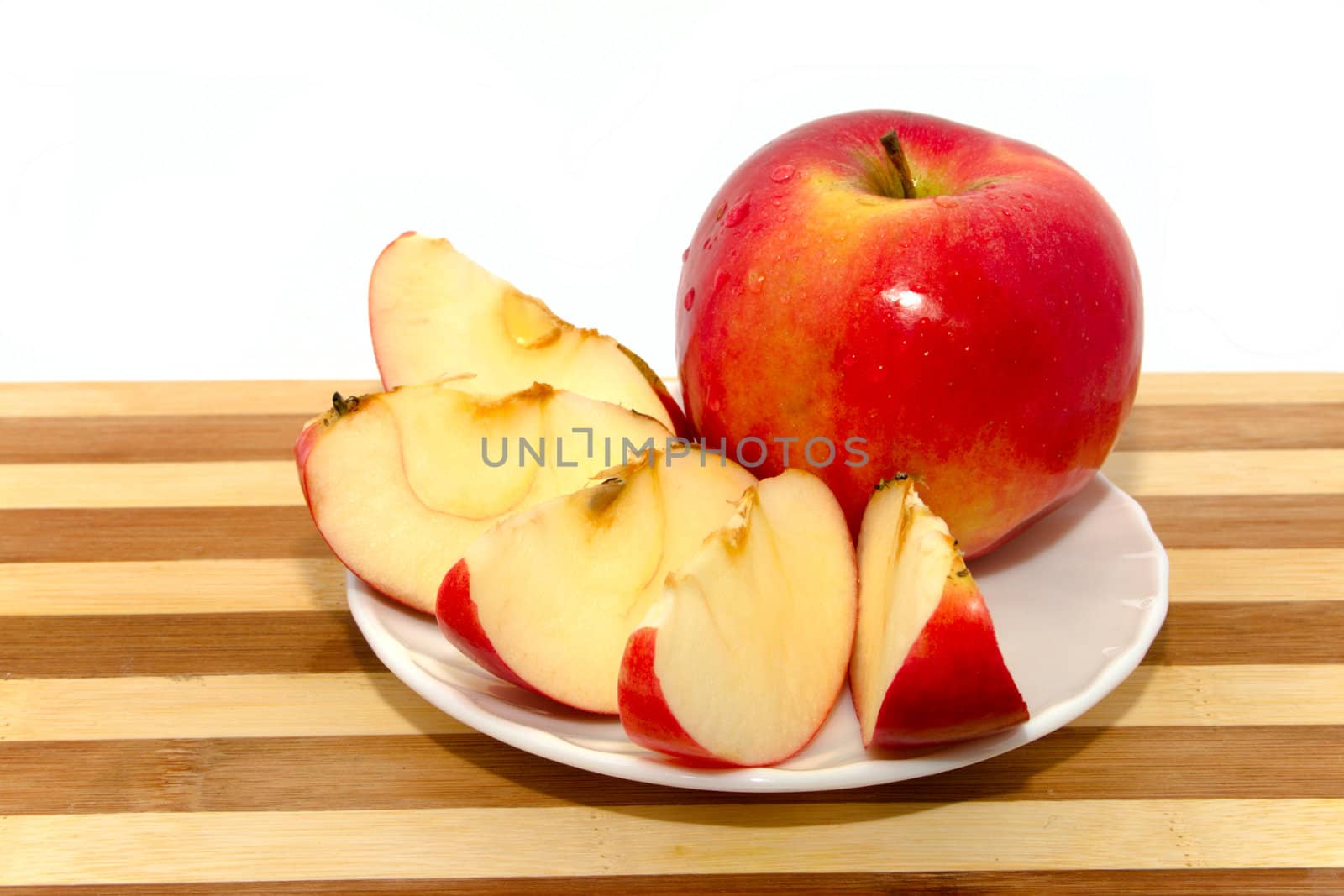 Red apple on chopping board