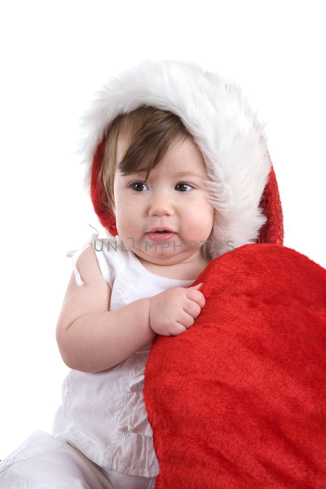 Cute little christmas angel holding on to a big red heart