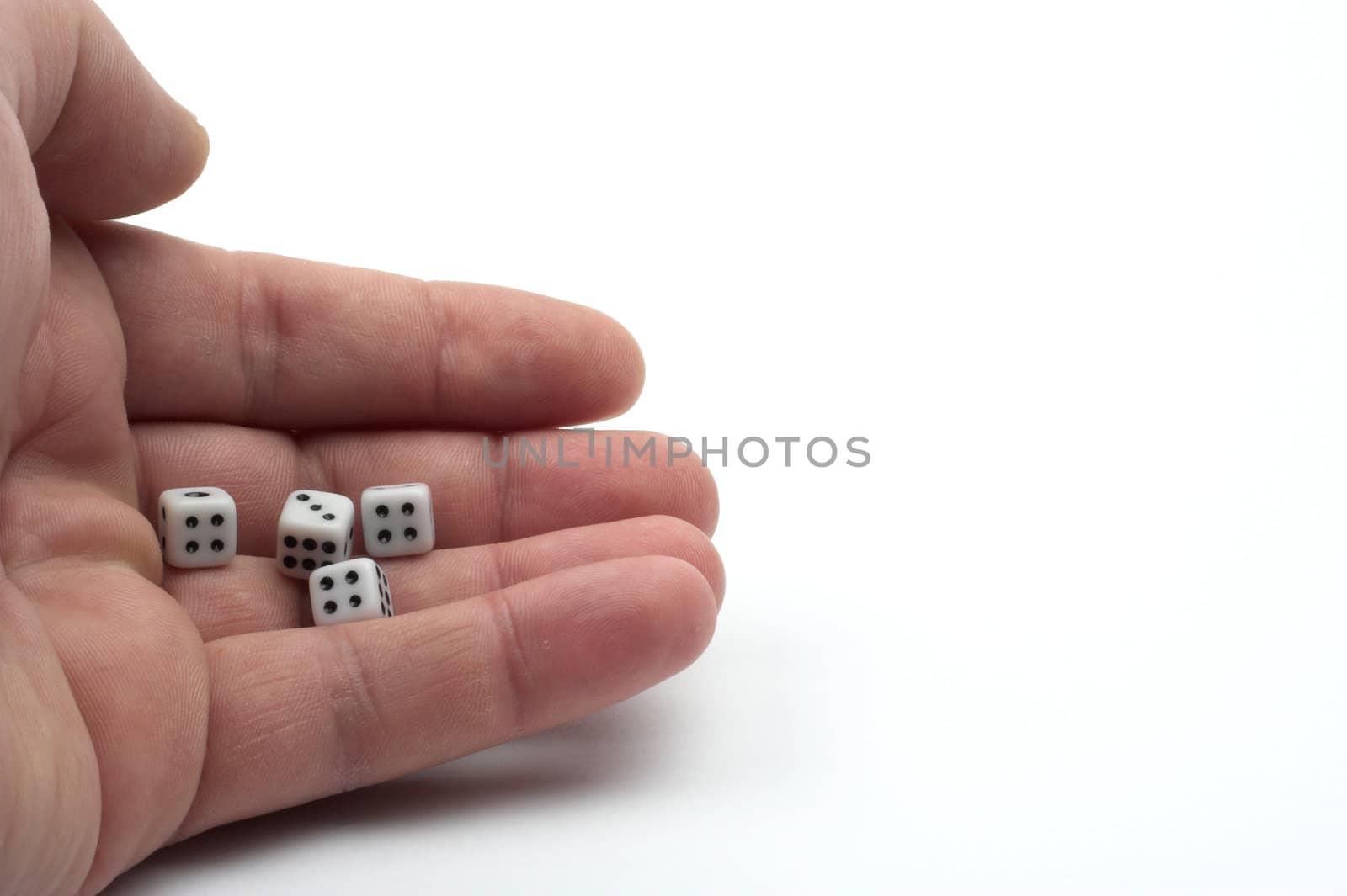 Dices in hand over white background