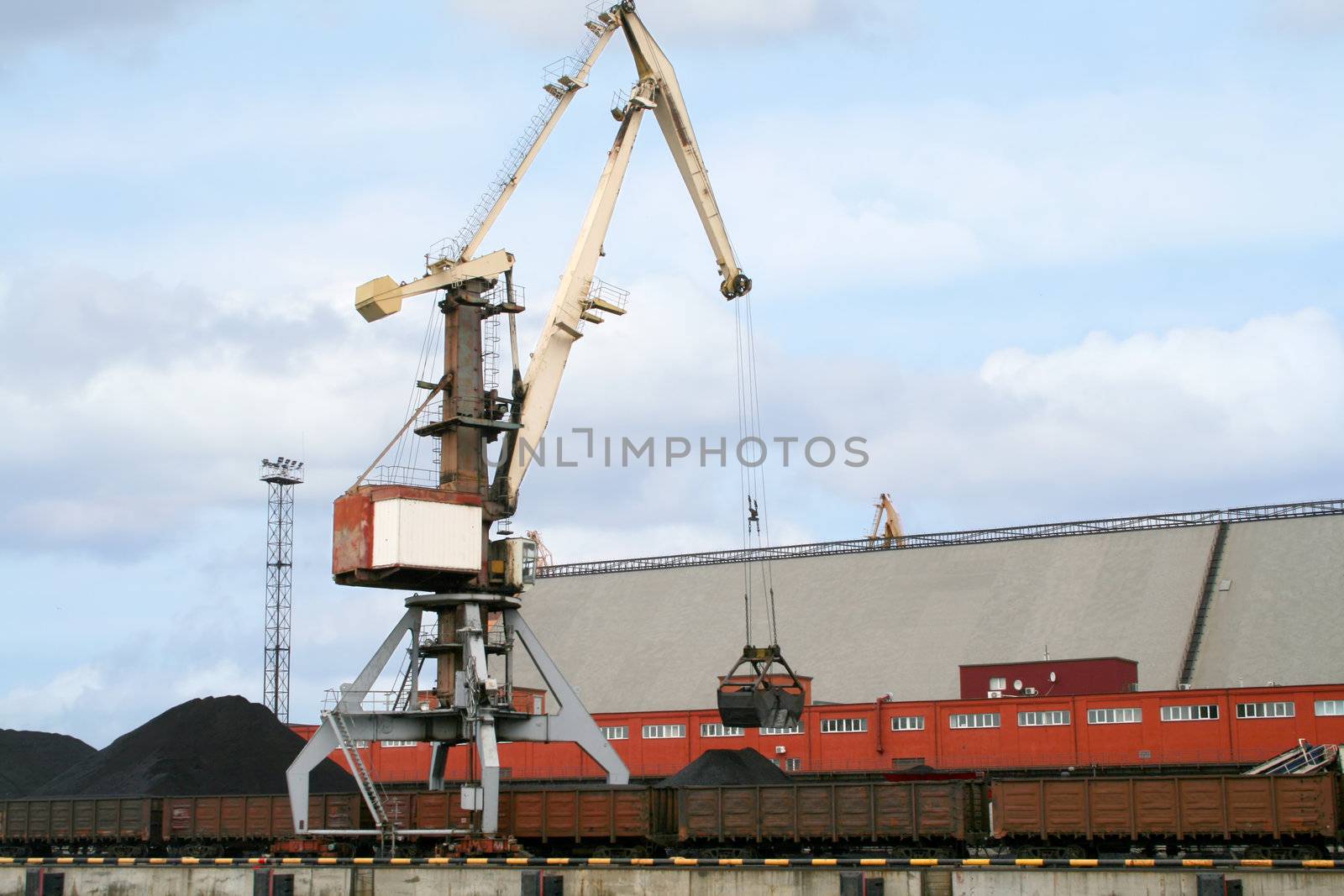 Container cranes for loading and unloading freight trains in Latvian port