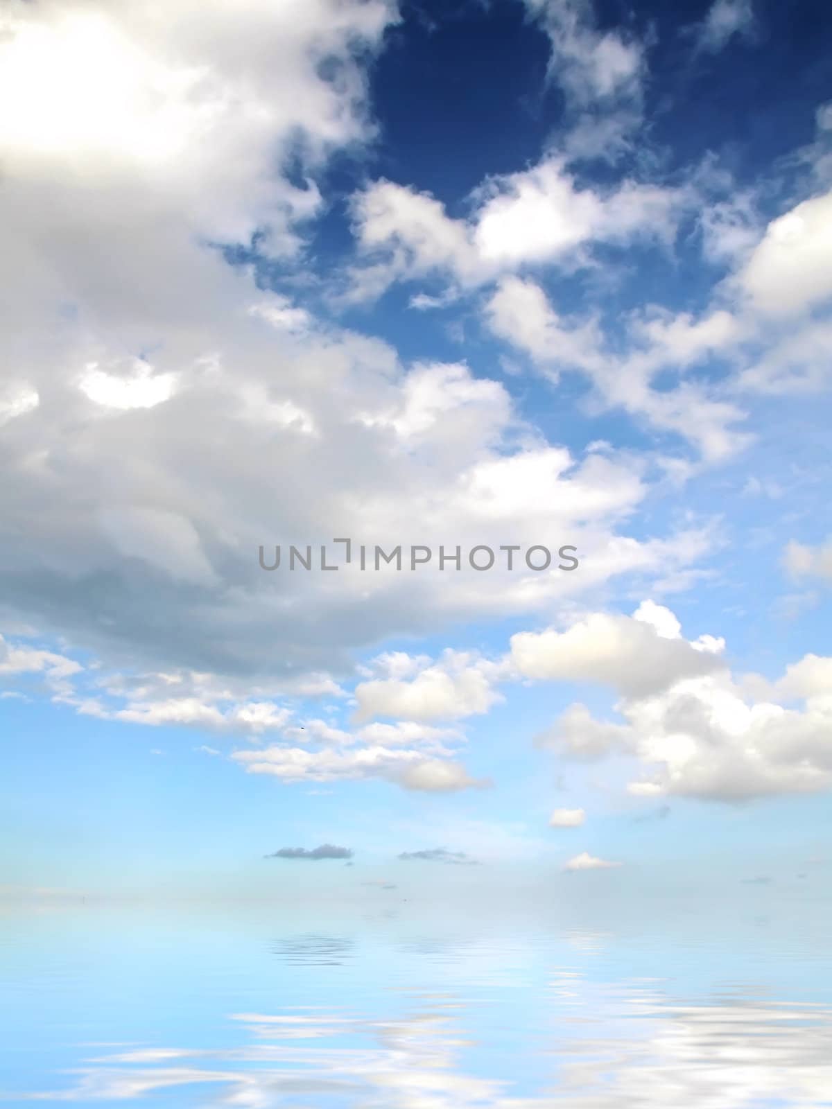 Clouds looming over the horizon with deep blue sky in background