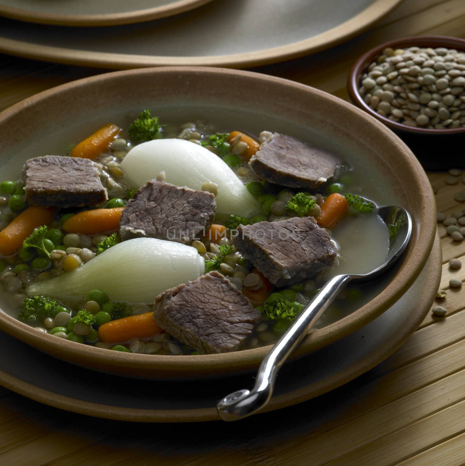 beef soup with vegetables and lentils