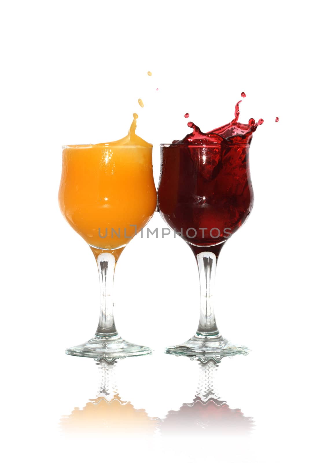 Two goblets of orange and cherry juice isolated on white background with clipping path