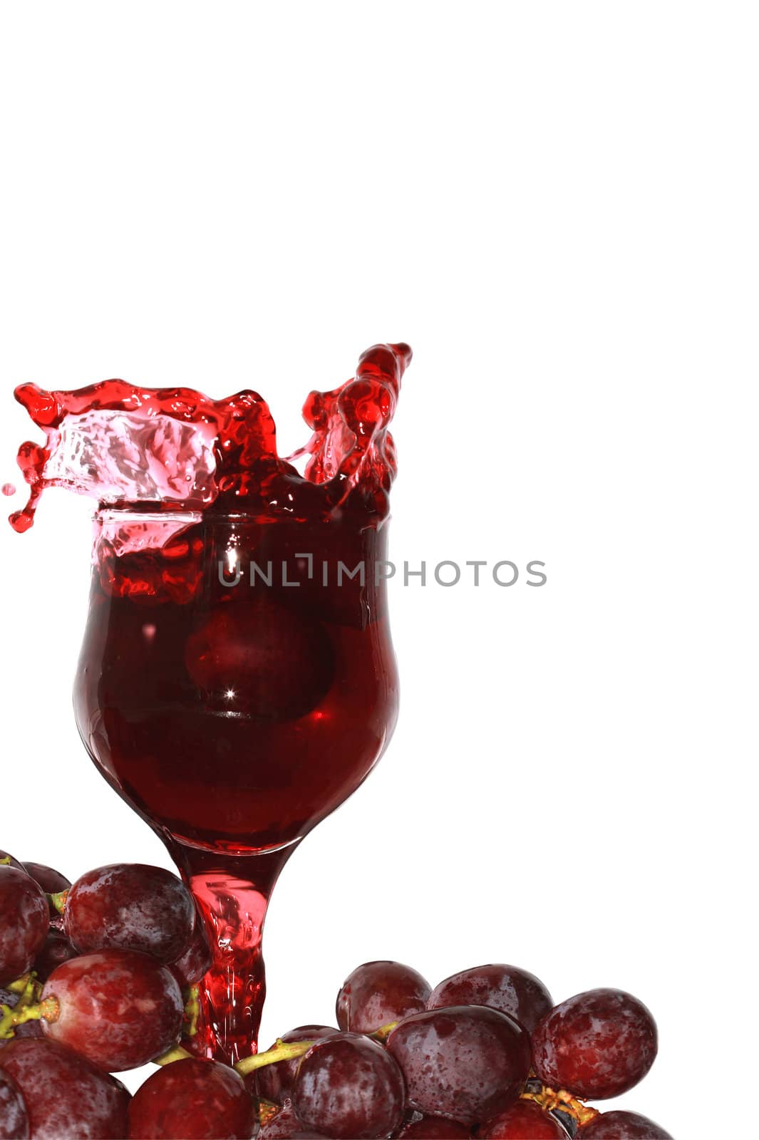 Goblet of red wine and grapes bunch isolated on white with clipping path