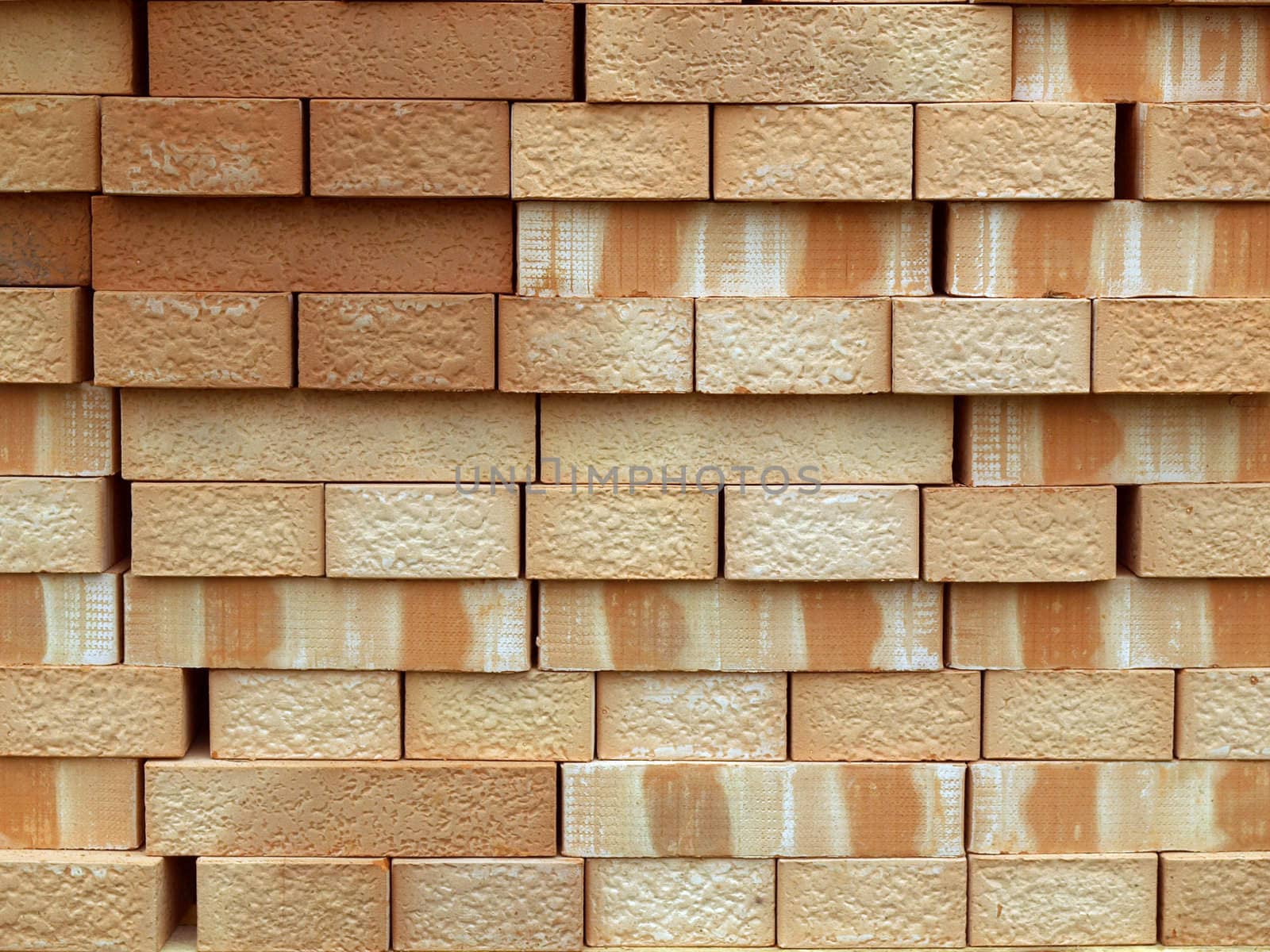 Pile or pallet of red bricks for construction