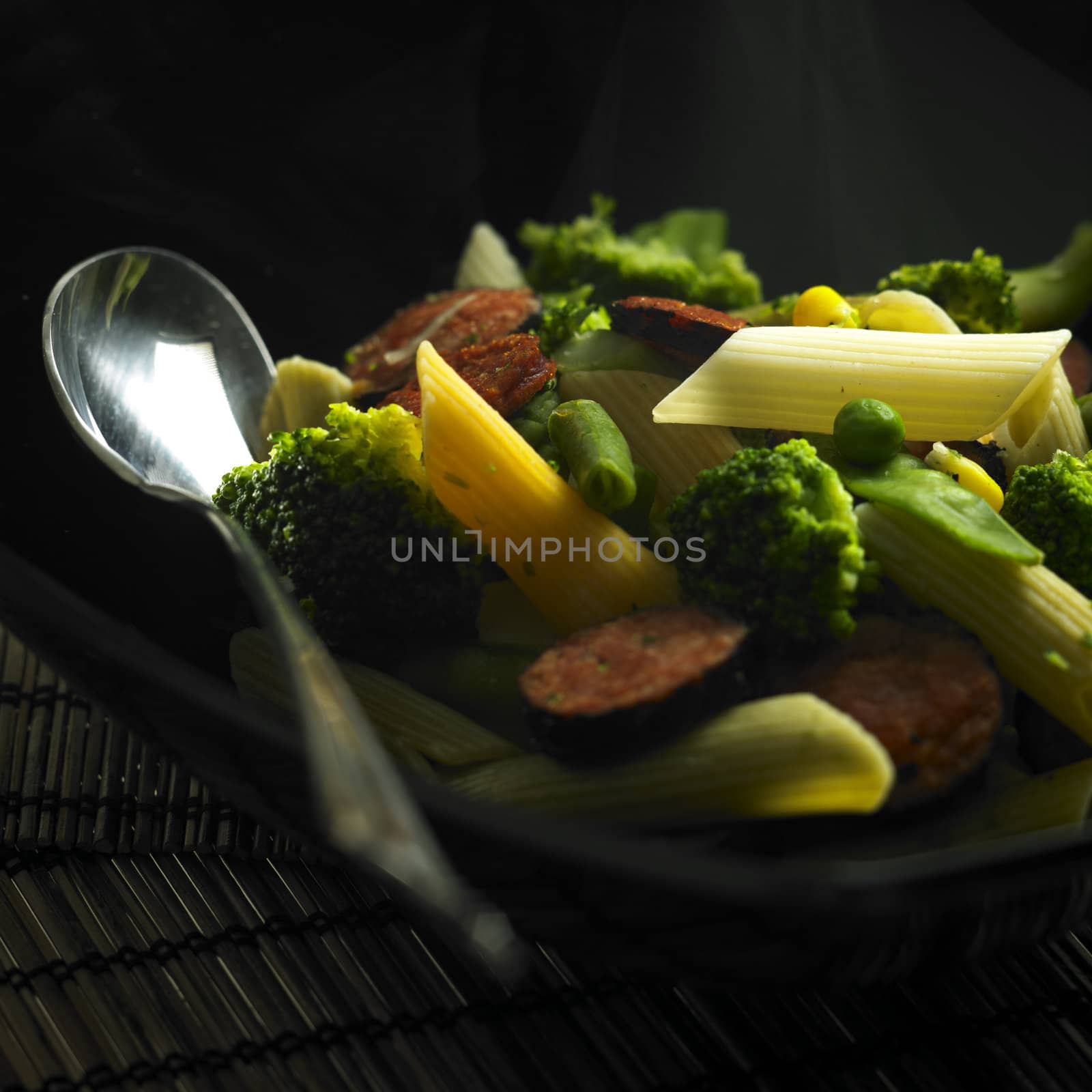 penne pasta with green vegetables and sausages by phbcz