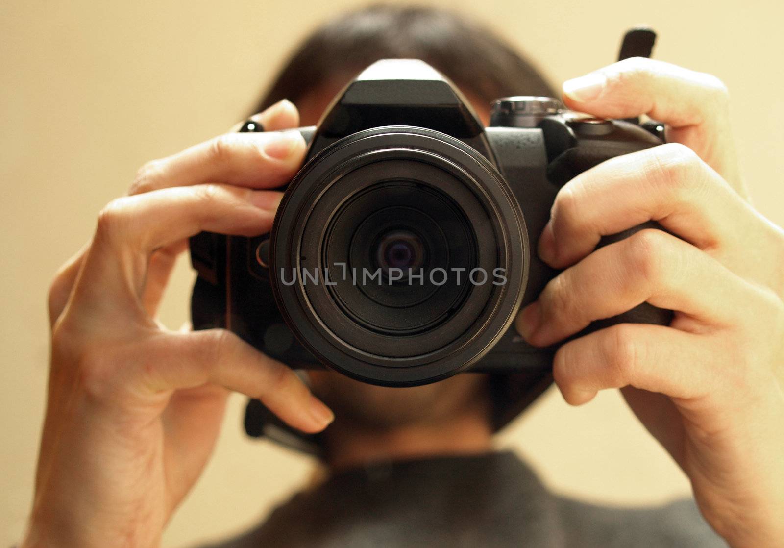 Self portrait of a photographer holding a camera