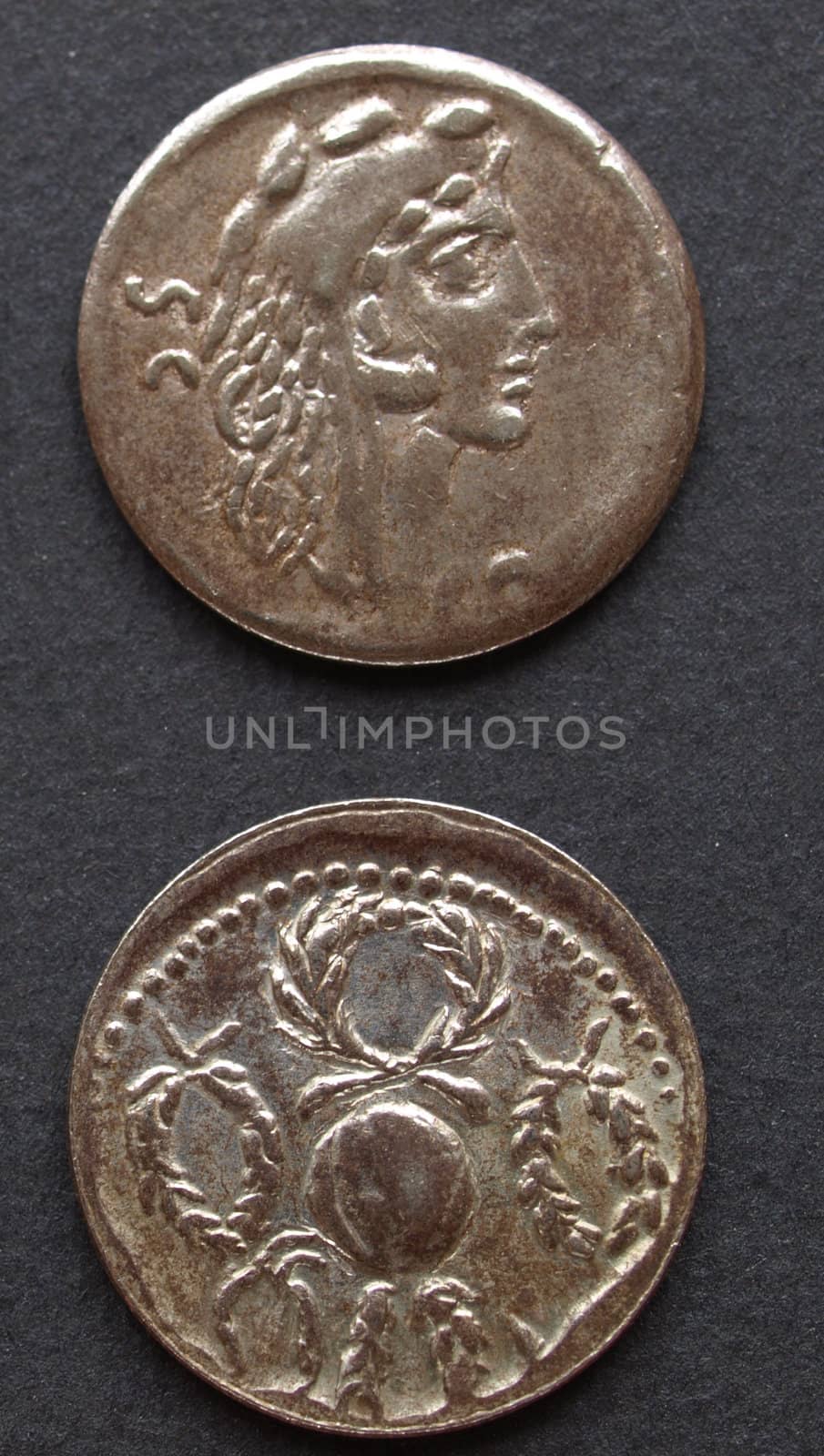 Ancient Roman coins on a black background