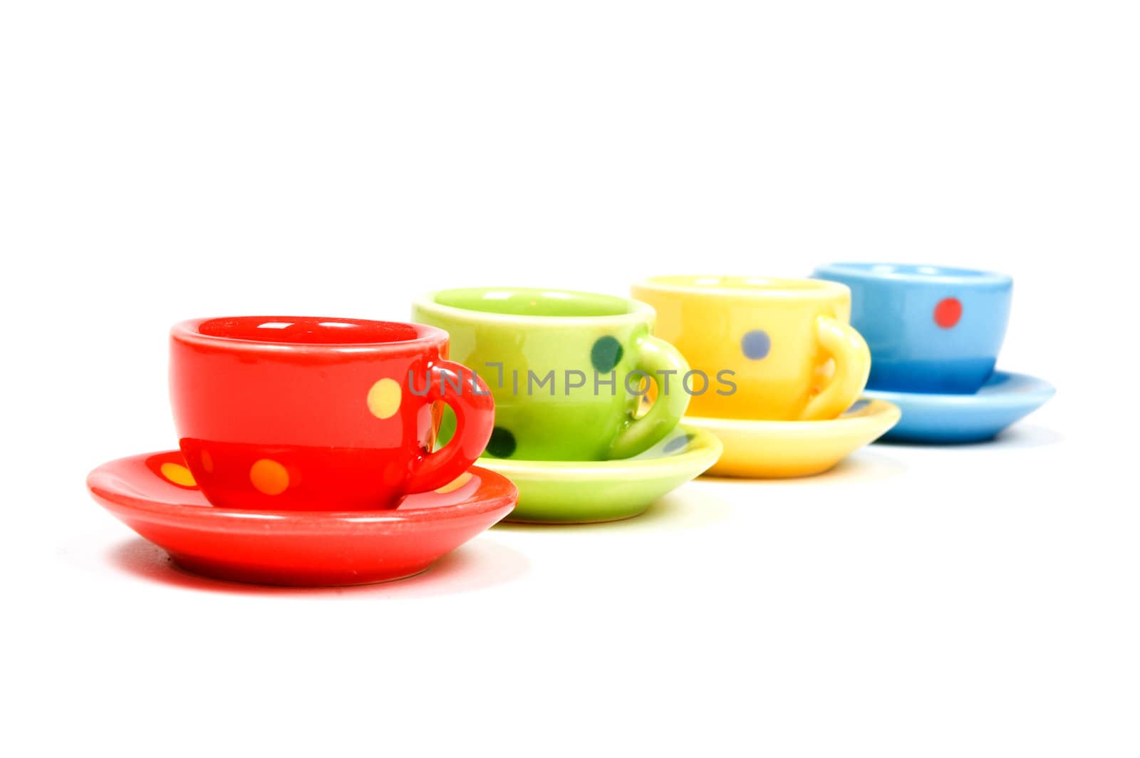 speckles cups and saucers isolated over white by ladyminnie