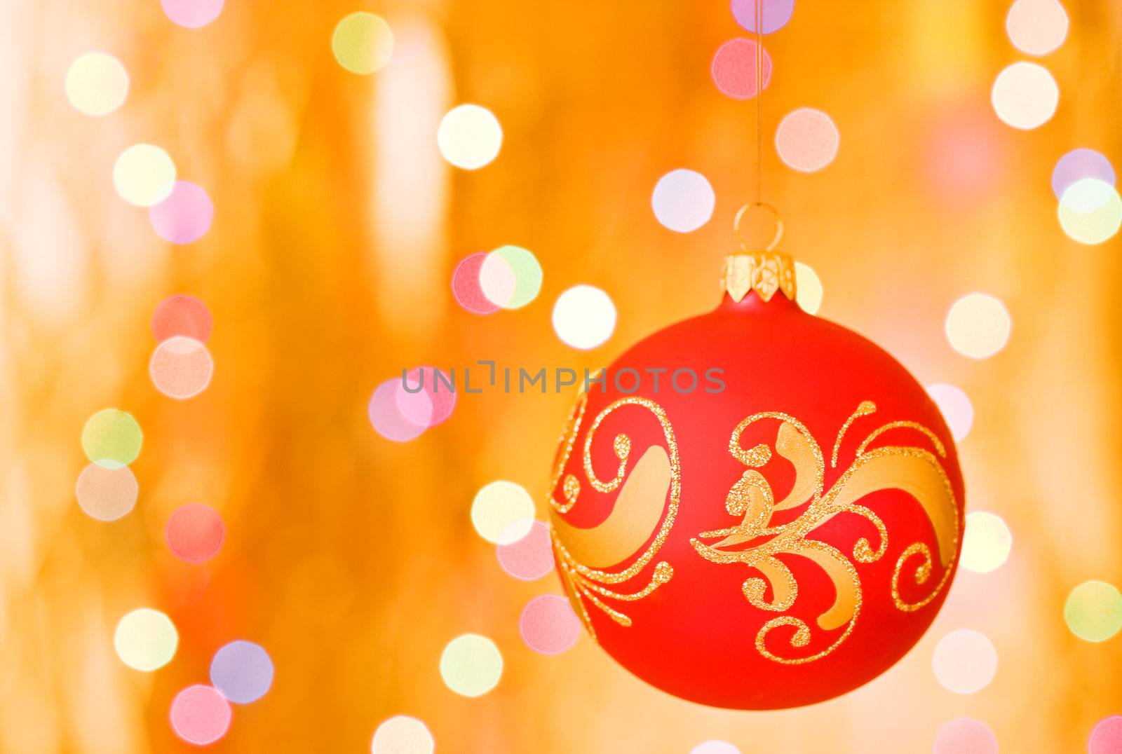 Christmas ornaments over gold blurred background by rozhenyuk
