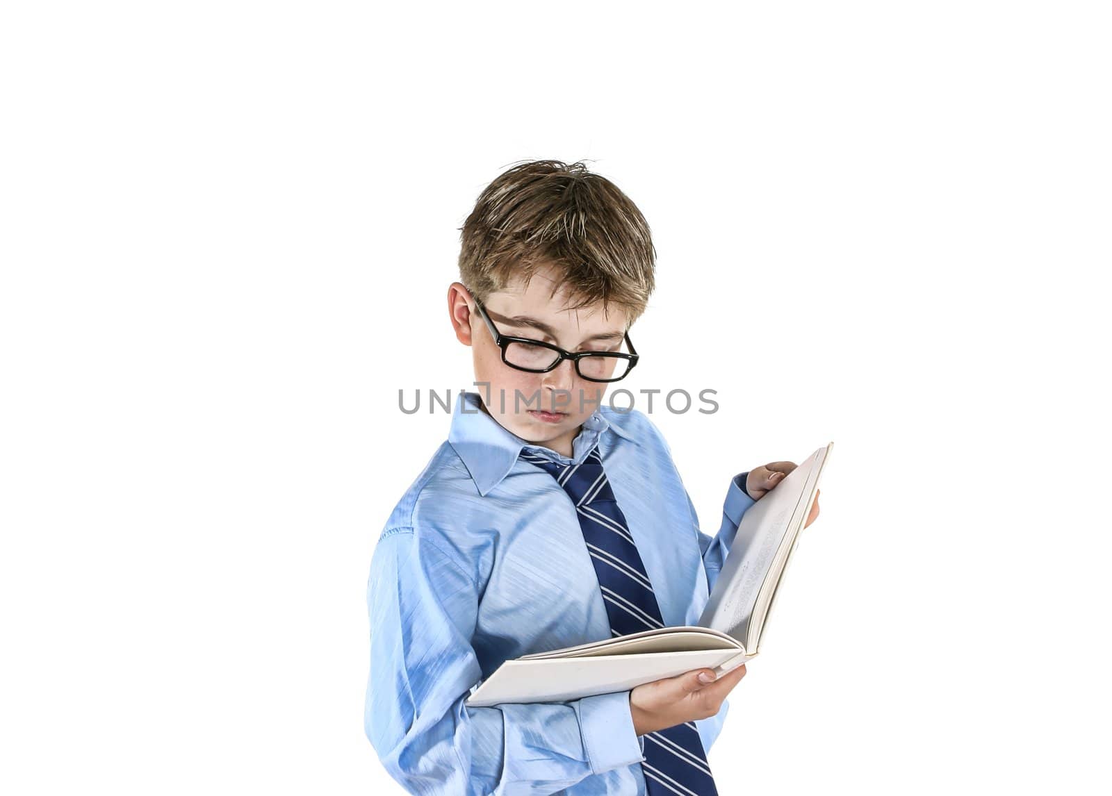 Boy wearing spectacles reading a book.  Please note this image has undergone a digital artistic treatment.