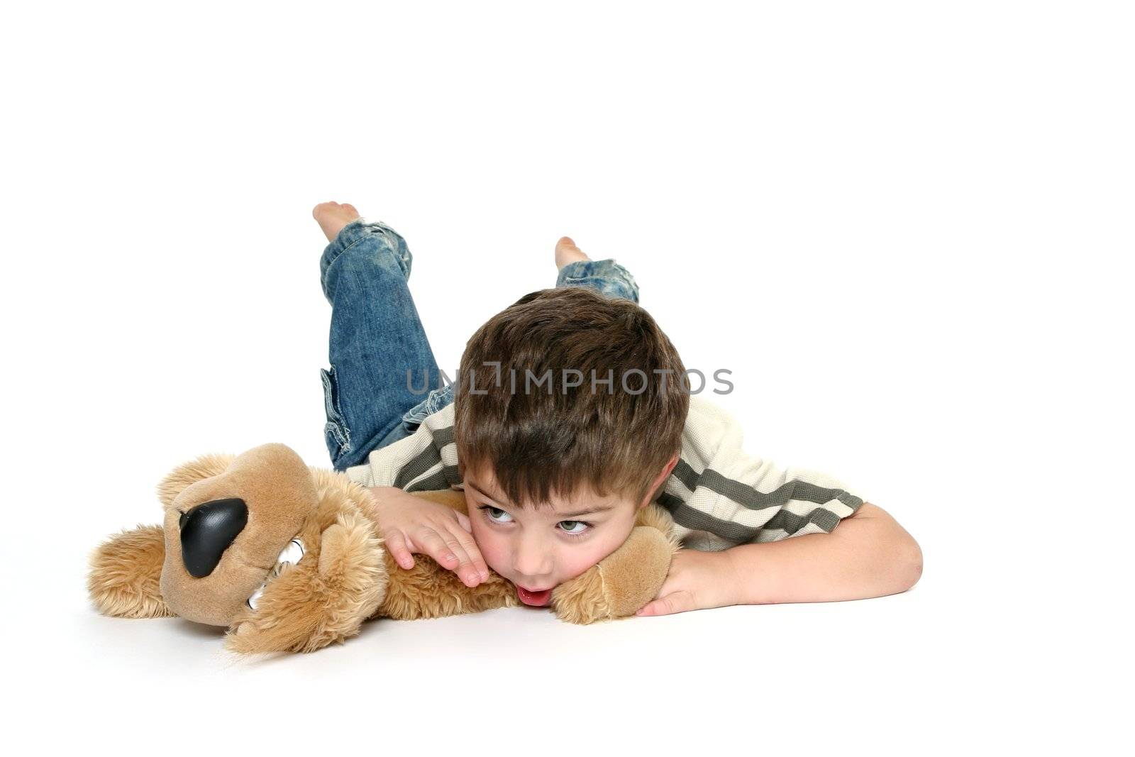 Young toddler boy with his favorite toy dog.