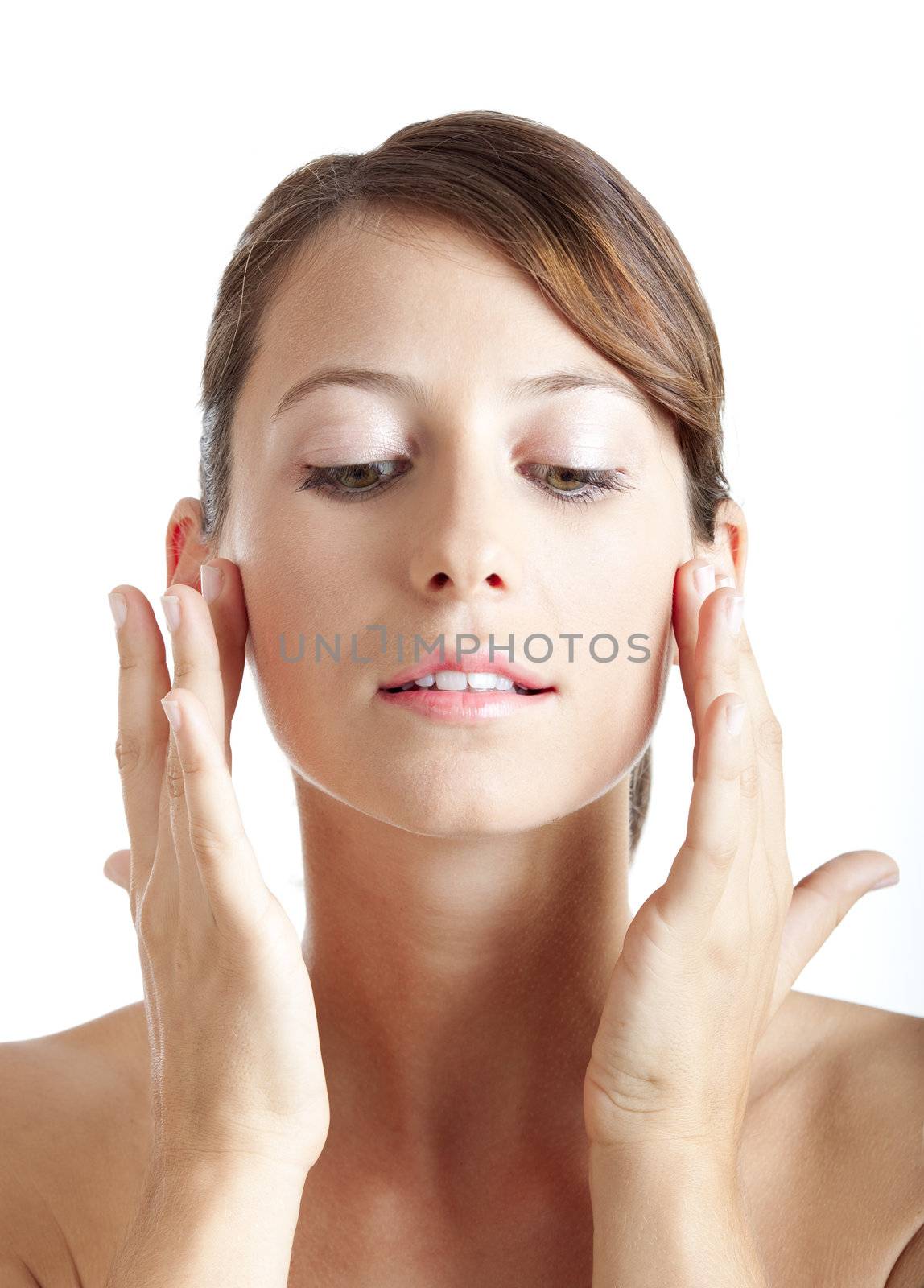 Beautiful young woman taking care of her skin face
