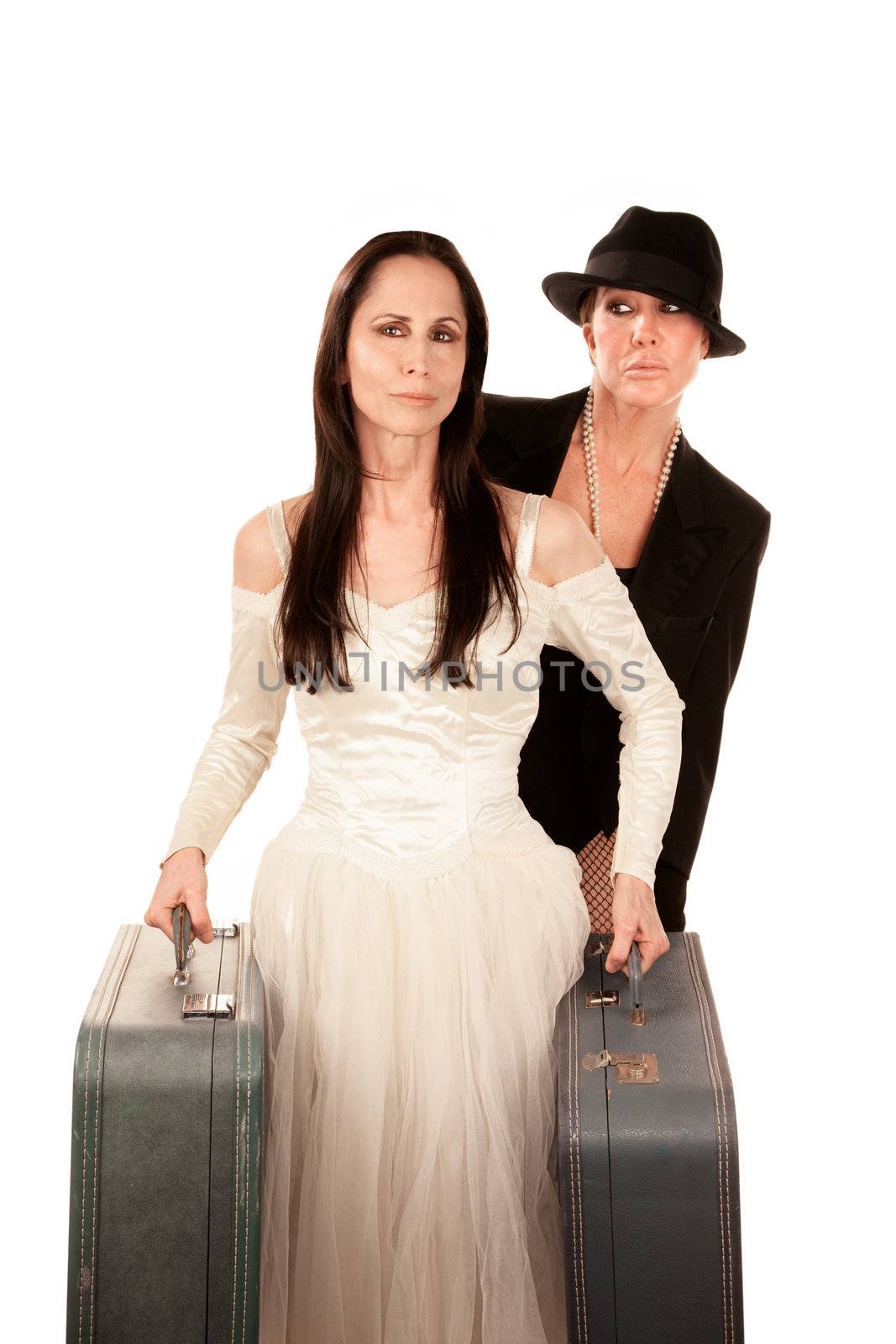 Two women dressed as traditional bride and groom