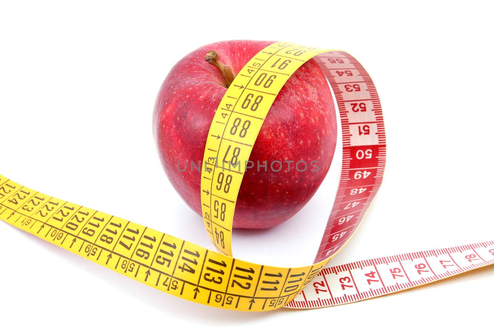 apple and measuring tape isolated on white background